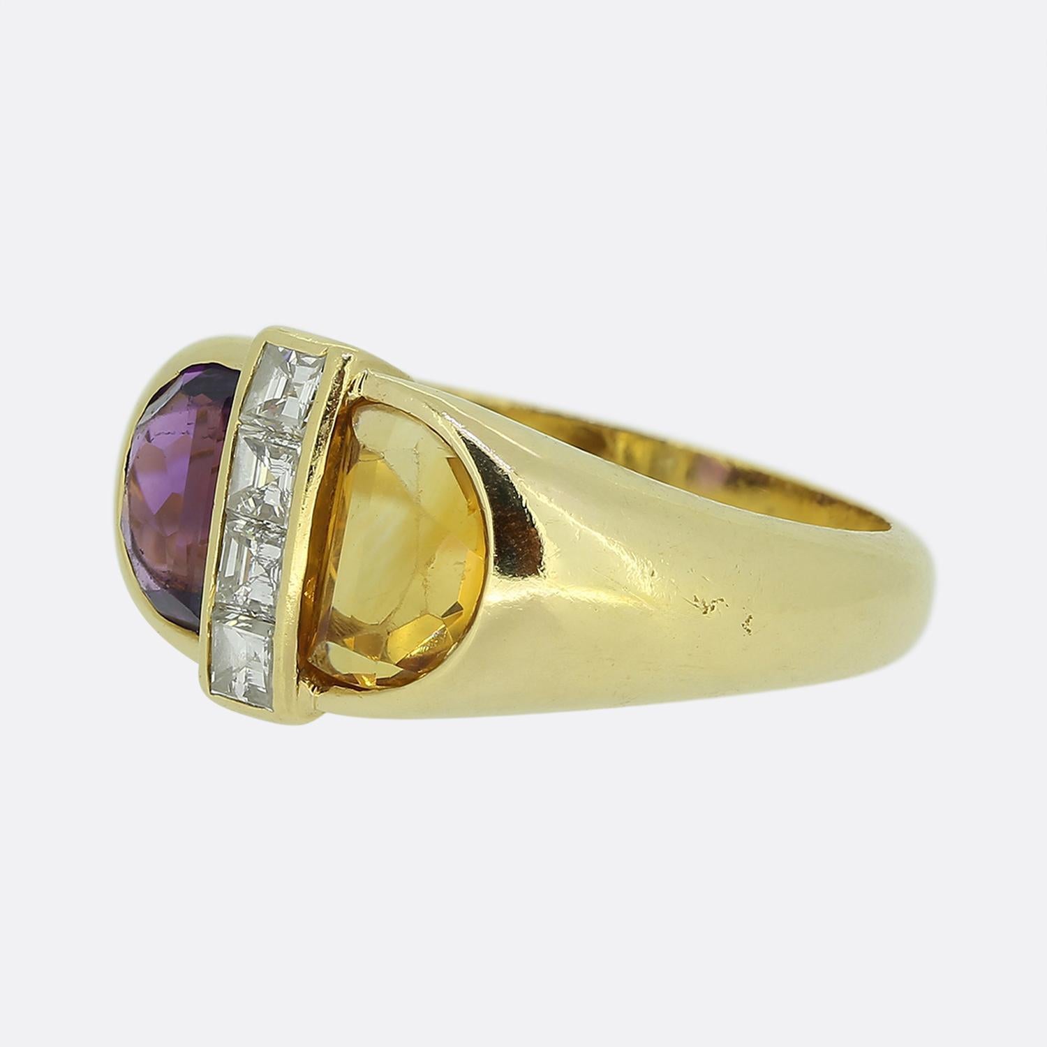 Here we have a chic and stylish ring from the world renowned luxury jewellery house of Cartier. The ring features a striking design with a purple amethyst and an orange citrine, each set in a half-moon shape. Between them, a vertical row of