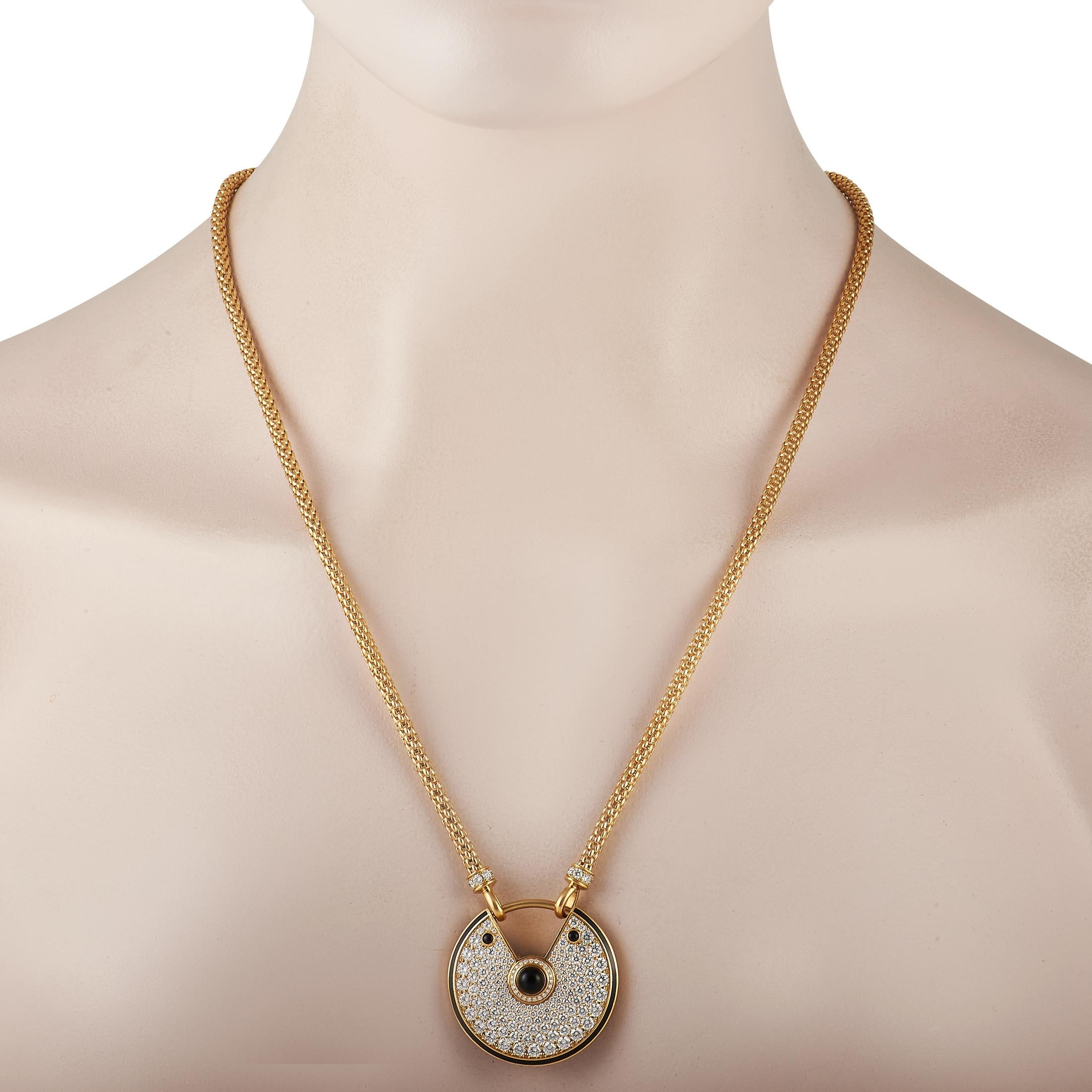 Like all pieces from the Cartier Amulette De Cartier collection, this pendant necklace features a luxurious talisman meant to resemble a padlock. This piece's 1.25” round pendant comes to life thanks to thoughtfully placed black accents and diamonds