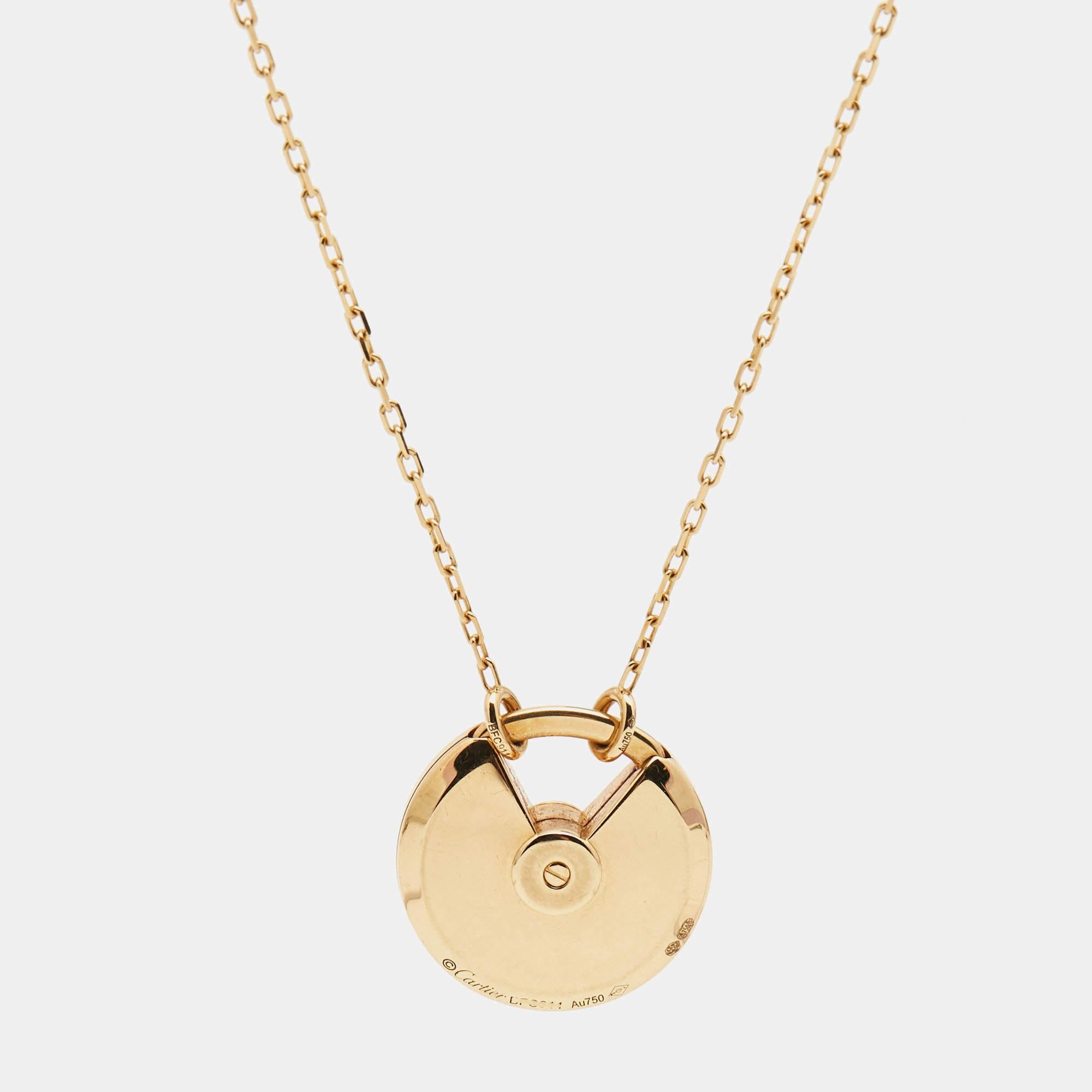 A minimal yet magnificent offering from Cartier's Amulette de Cartier line. The necklace comes sculpted in 18k yellow gold and it has the signature motif in lapis lazuli highlighted by a shimmering diamond. Smoothly finished, the desirable creation