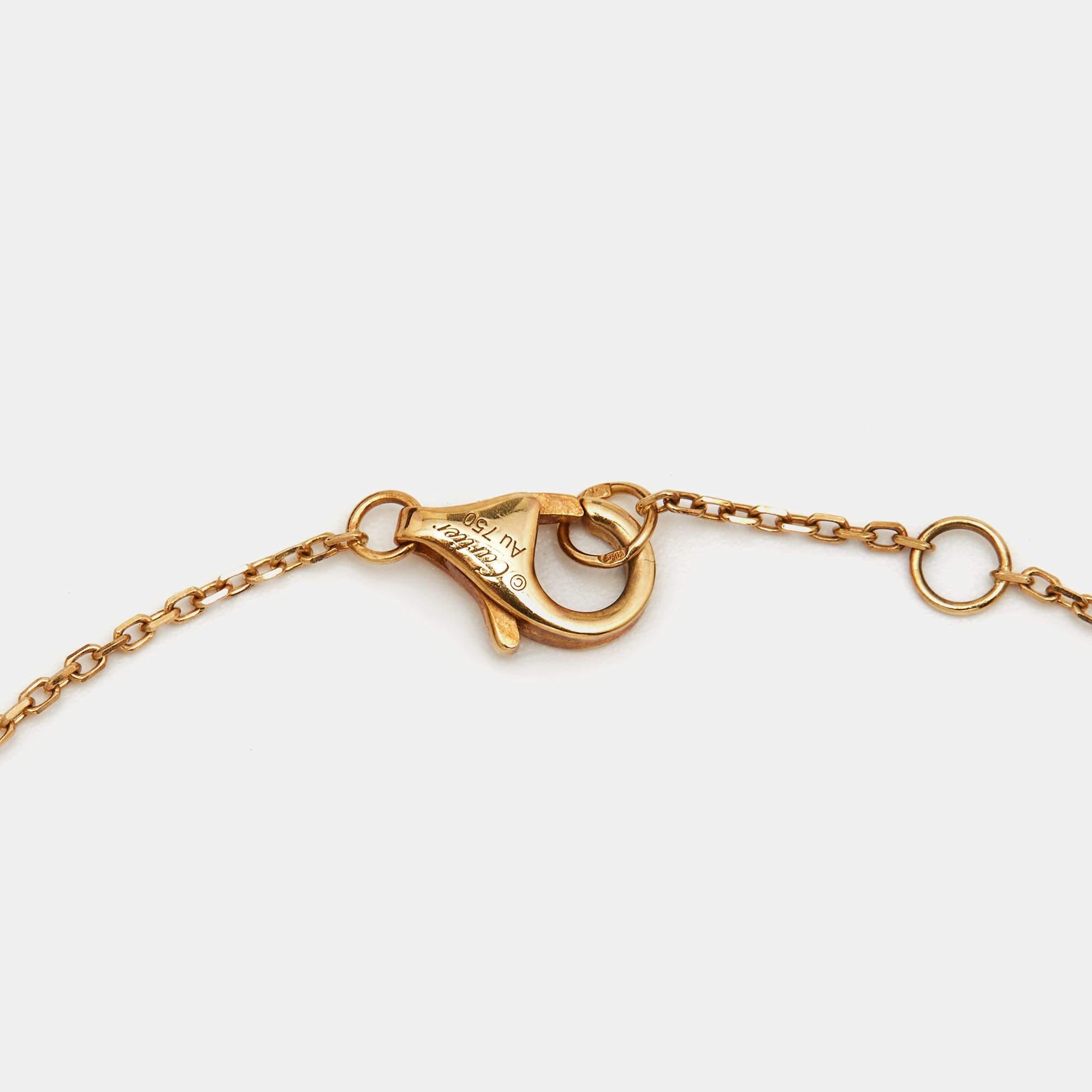 A magnificent offering from Cartier's Amulette de Cartier line. The bracelet comes sculpted from 18k yellow gold, and it has the signature motif in mother of pearl highlighted by a shimmering diamond. Smoothly finished, the desirable creation