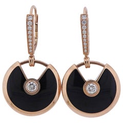 Cartier, boucles d'oreilles Amulette en or, onyx et diamants