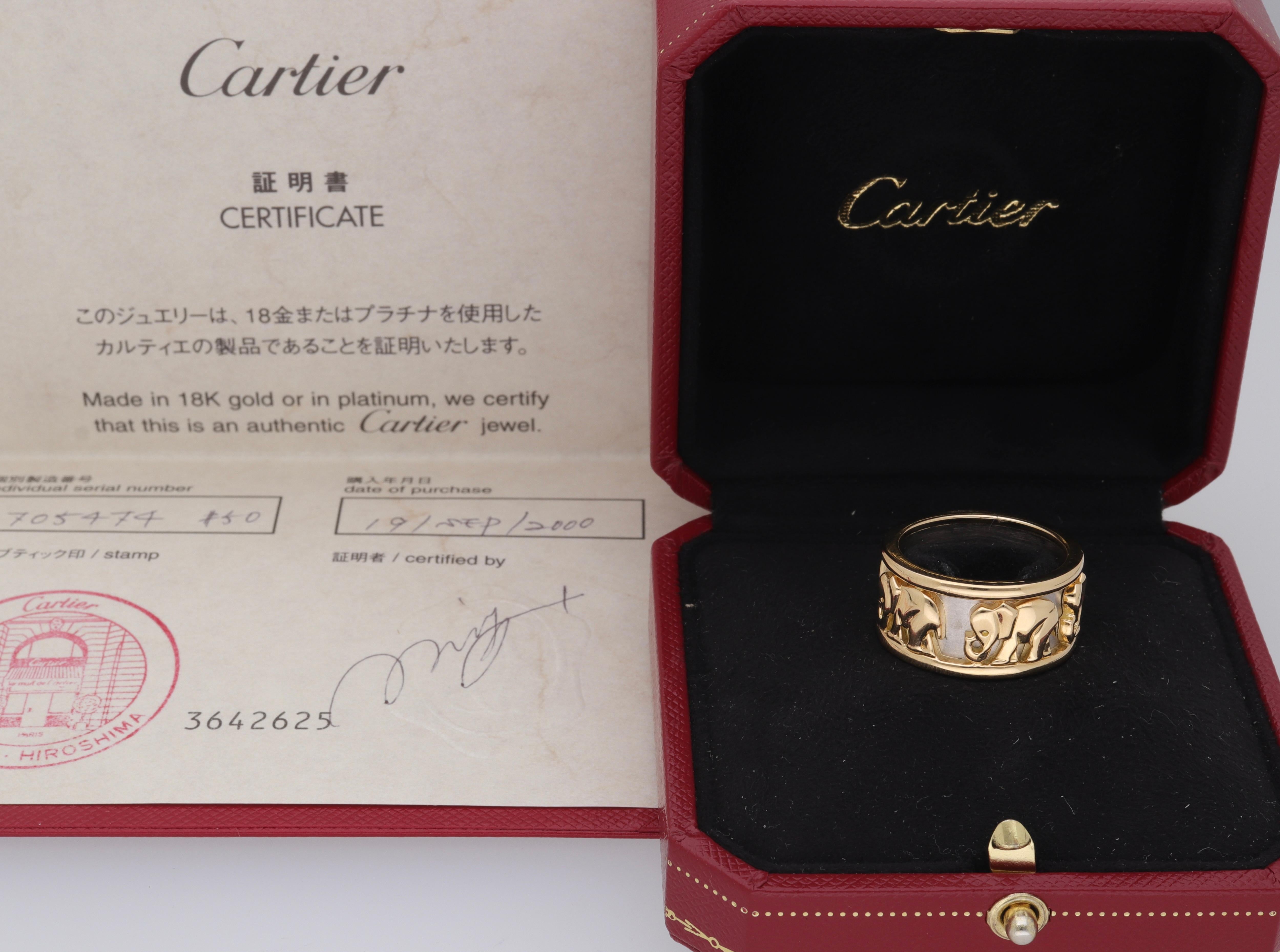 Ring made of 18 kt. white and yellow gold signed Cartier.
This beautiful band ring is made with 5 elephants that appear to walk inside the band.
The jewel design is now out of production.
The ring is sold with original box and warranty.

18 kt. gold
