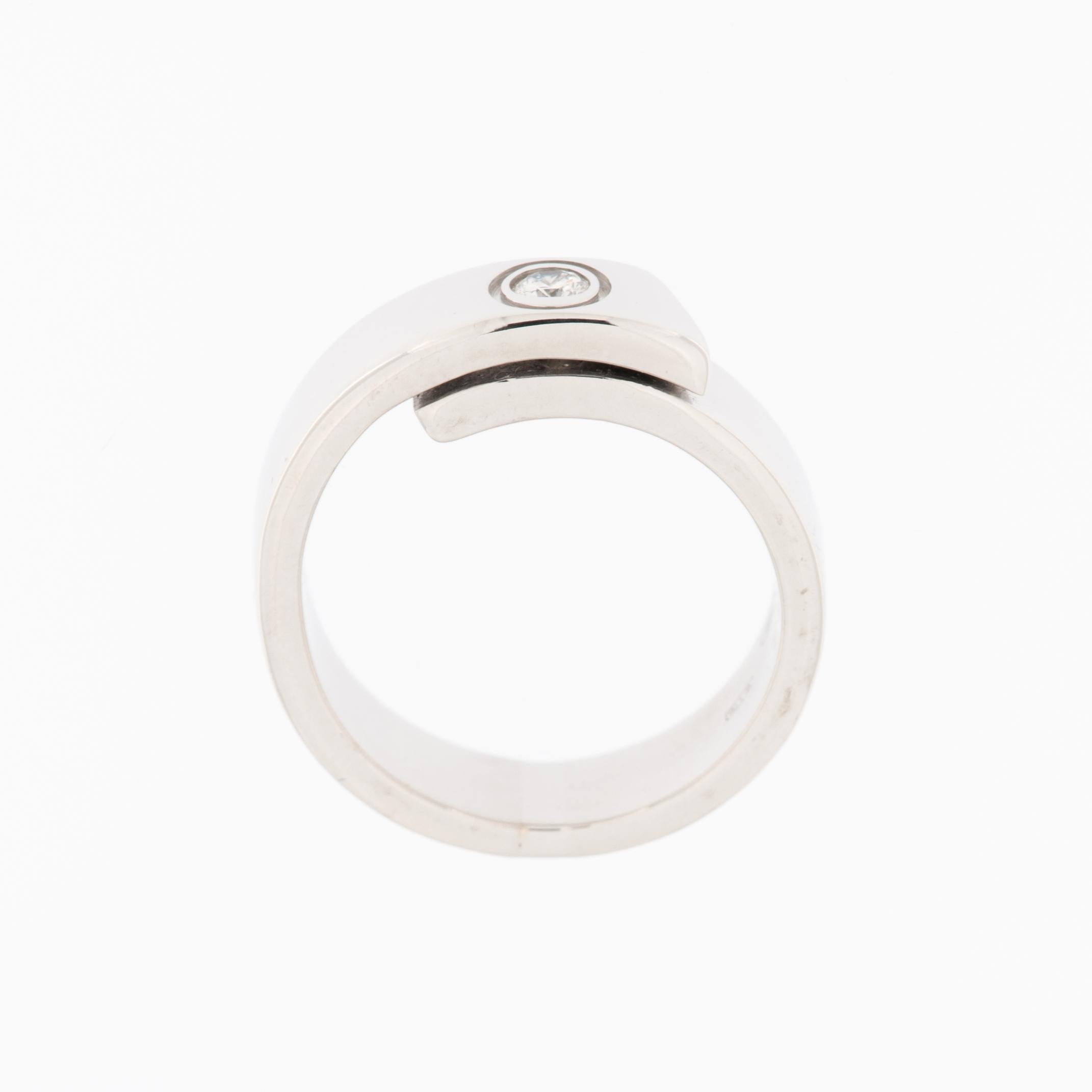 This Cartier Anniversary Band Ring is a true masterpiece, showcasing the renowned craftsmanship and timeless elegance synonymous with the Cartier brand. Meticulously crafted from lustrous 18 karat white gold, the ring embodies sophistication and