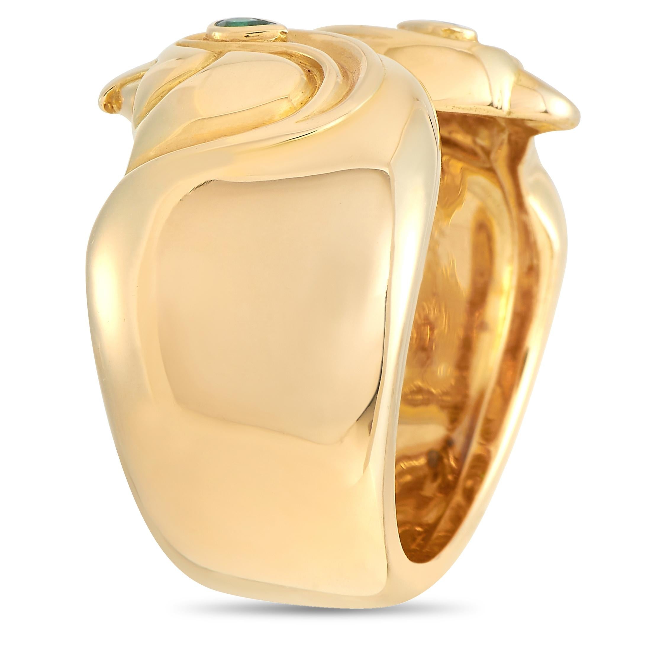 You’ll feel like modern royalty whenever you have on this impeccably designed Cartier Anoubois Ring. Inspired by Egyptian gods, this 18K Yellow Gold ring features twin falcon motifs. This piece features a 10mm wide band, a 1mm top height, and green