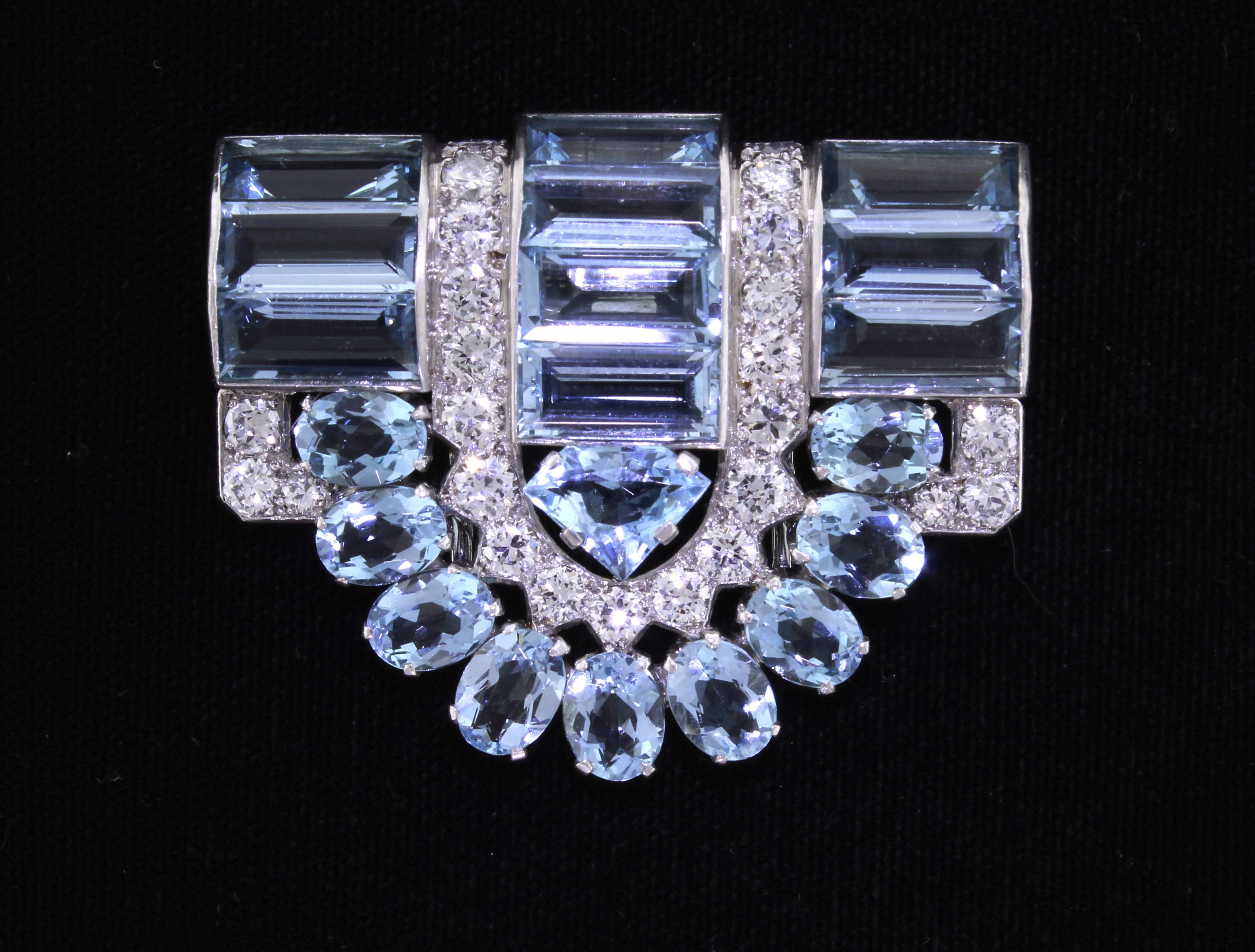 In the 1930s the French jeweler, Louis Cartier designed  the dress clips.  This highly important Aquamarine clip boast 20 oval and 10 baguette aquamarines with 25 diamonds weighing 3.75 carats.  Signed Cartier, London, set in platinum

Princess