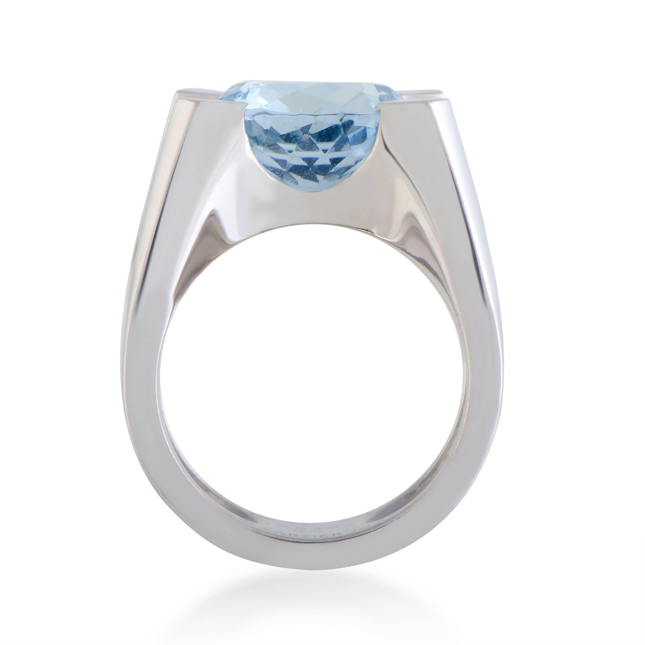 This breathtaking ring is beautifully designed by Cartier in shimmering 18K white gold. The elegant ring displays an exquisitely charming appeal with its extravagant embellishment of a captivating blue aquamarine stone that makes the piece