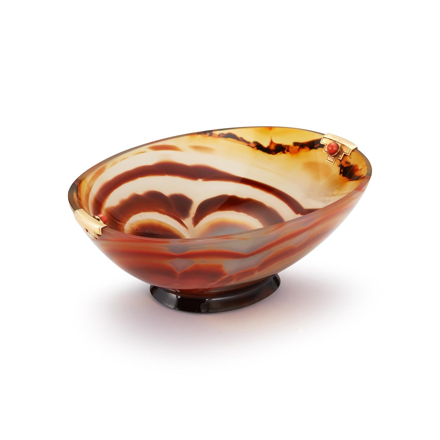 Cartier Art Deco Agate and Coral Bowl

Signed Cartier, numbered, and french hallmarked 
Measurements: length: 3.5” , width: 2.5”,  height: 1.5”