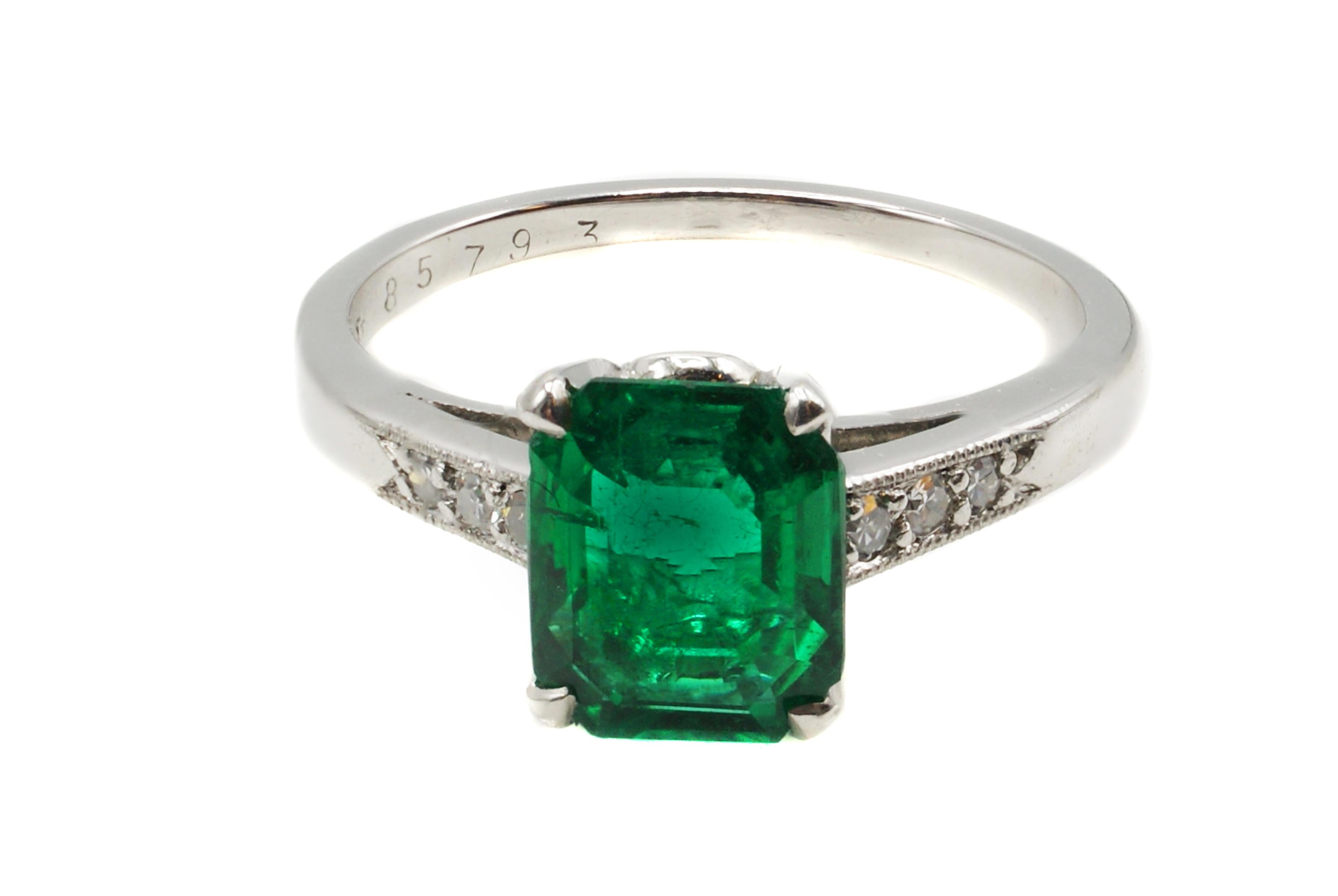 This original Art Deco ring, ca. 1925, by Cartier features a fine Colombian emerald weighing 1.72 carats. The luscious deep forest green emerald perfectly cut as a rectangular step-cut brings an amazing life to this gem. Accompanied by a report from