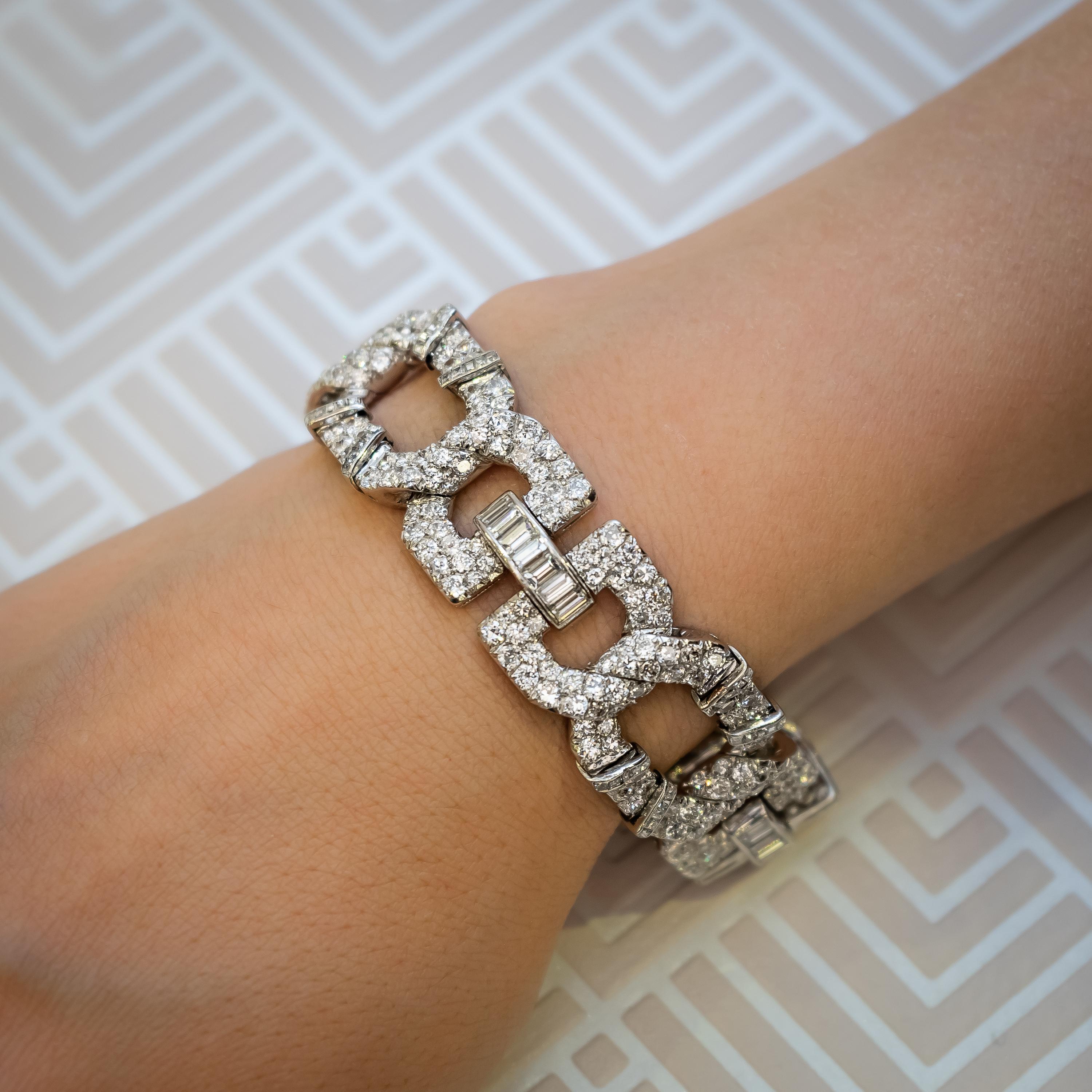 An Art Deco diamond bracelet by Cartier Paris, for Cartier New York, comprising four flexible segments, designed with an elongated octagonal buckle, enhanced by four, raised ribbons of channel set square-cut diamonds, flanked by two, entwined,