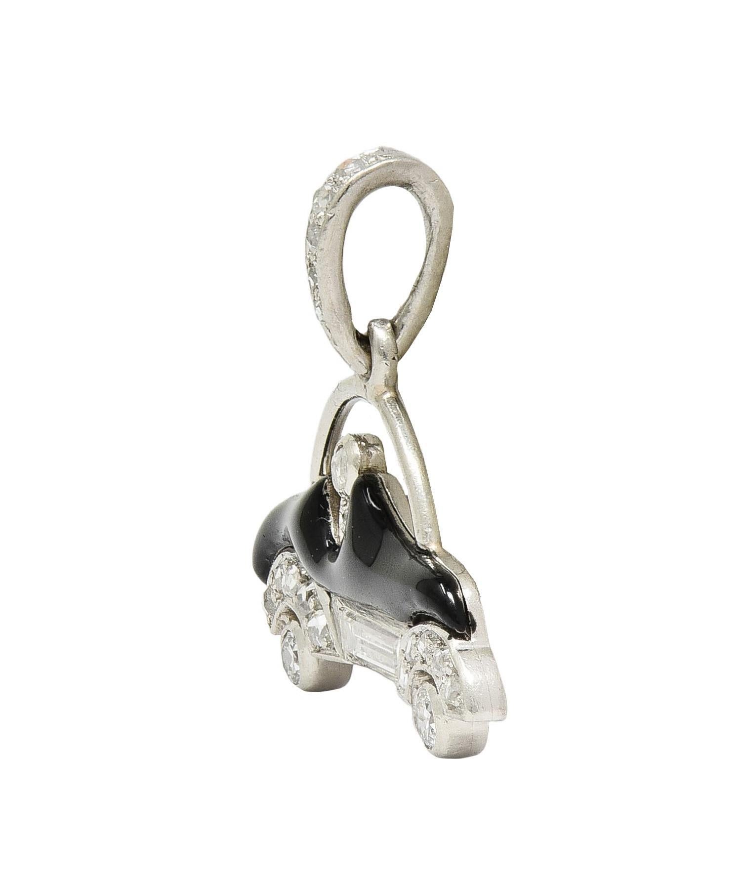 Designed as a stylized car suspending from a tapered bale 
Pierced with open top, seated driver, and wheels
Bead and bezel set throughout with rose cut diamonds
With additional baguette and old European cut diamonds
Weighing approximately 0.25