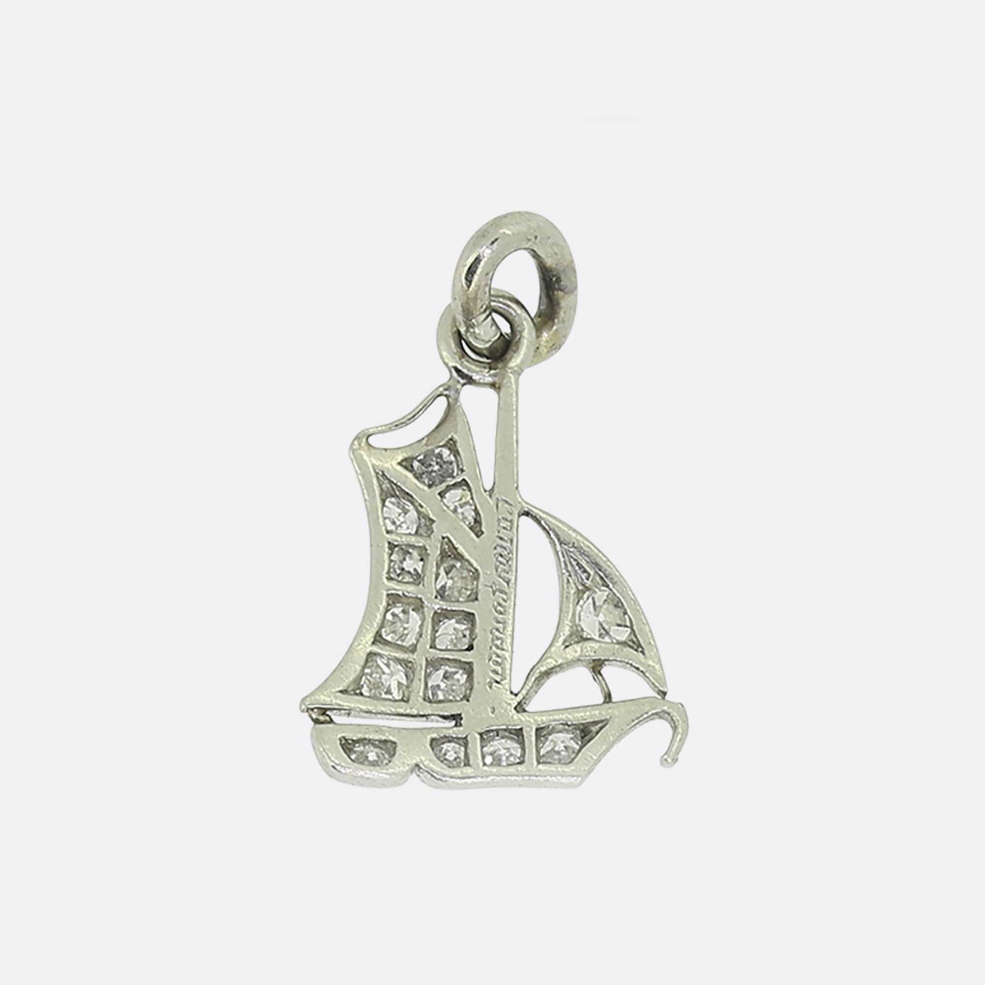 Here we have a marvellous original Art Deco charm come pendant from the world renowned luxury jewellery house of Cartier. This piece has been crafted from platinum into the shape of sailing boat with detailed features being pave set with round