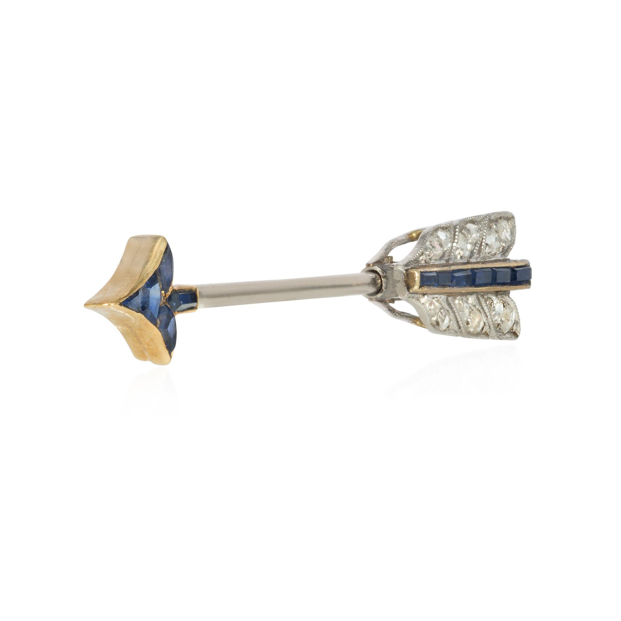An Art Deco diamond and calibre sapphire jabot brooch in the form of an arrow, in platinum and 18k gold.  Cartier #9.L7735, original box.

The delicate scale allows this to serve as an attractive but not overly dressy accent on a lapel or