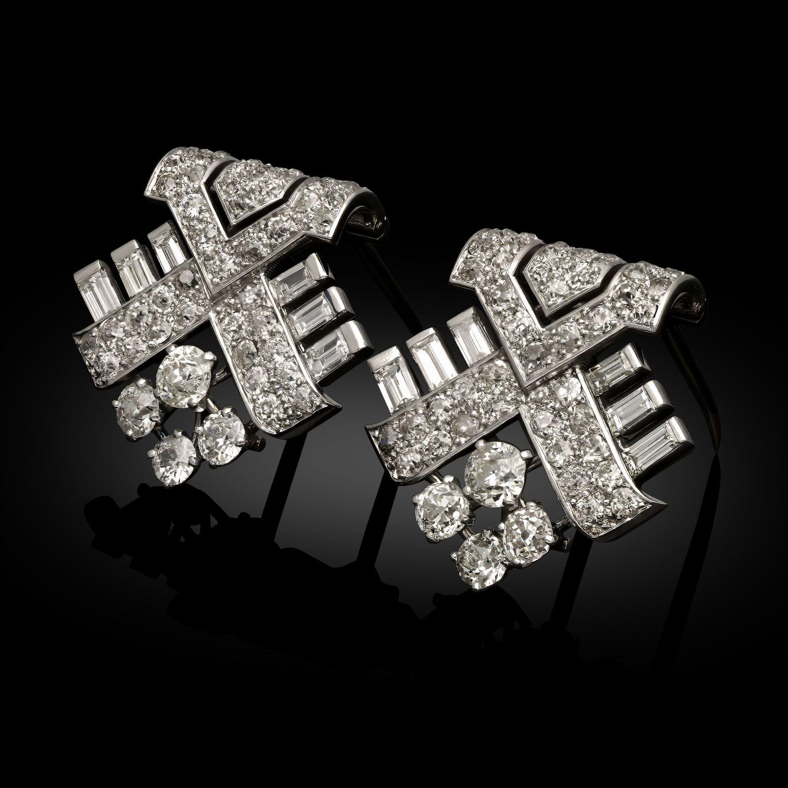 Maker:
Cartier
Summary:
Art Deco Geometric Diamond Clip Brooches
Description:
A pair of Art Deco diamond clip brooches by Cartier, circa 1930. The identical brooches are designed as intersecting stylised arrows set with old European cut diamonds,