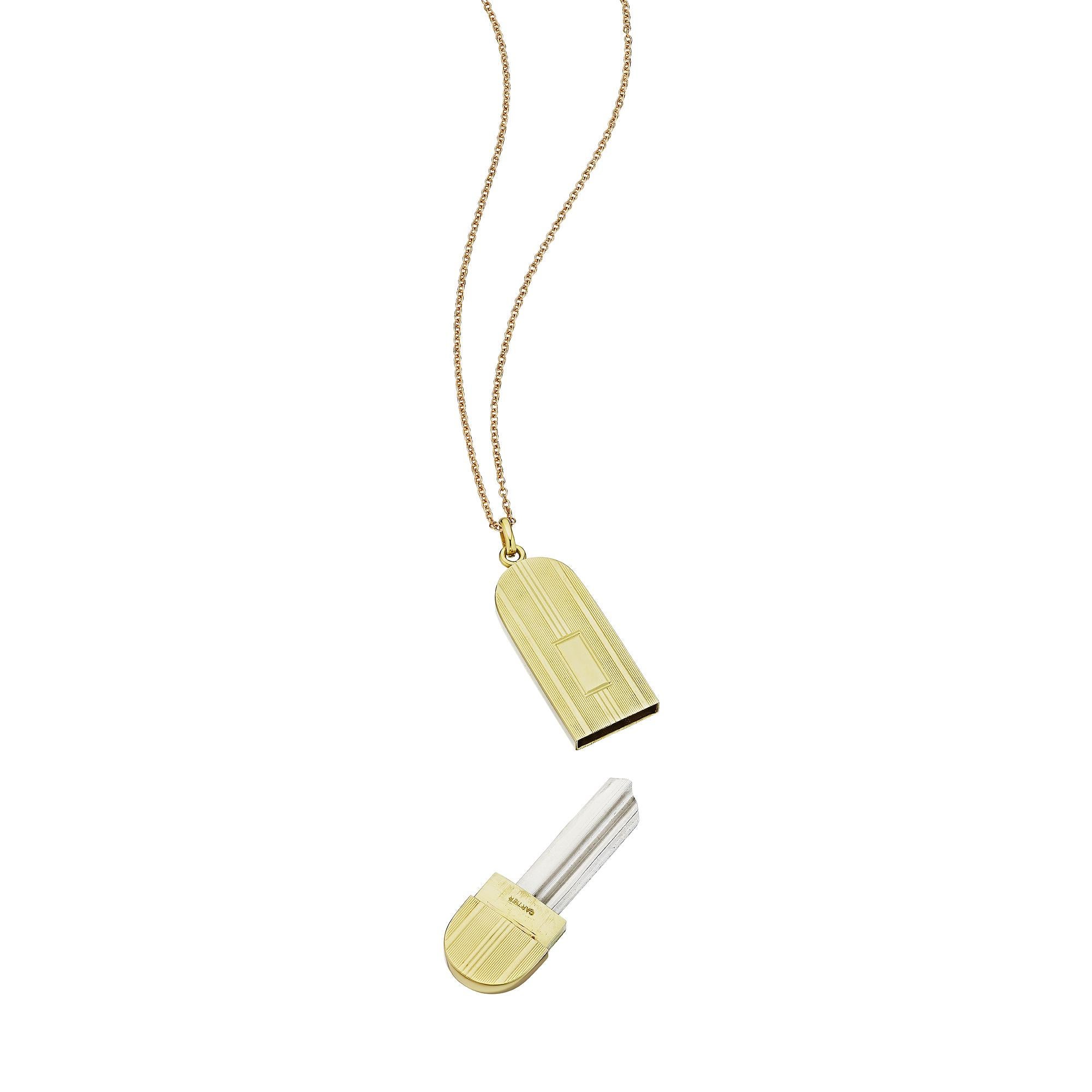 Give her the key to your heart with this Cartier Art Deco 14 karat yellow gold key case pendant necklace.  With a blank key enclosed in a handsome linear engraved oval case, that can be made into a personal key of your choice, this pendant necklace