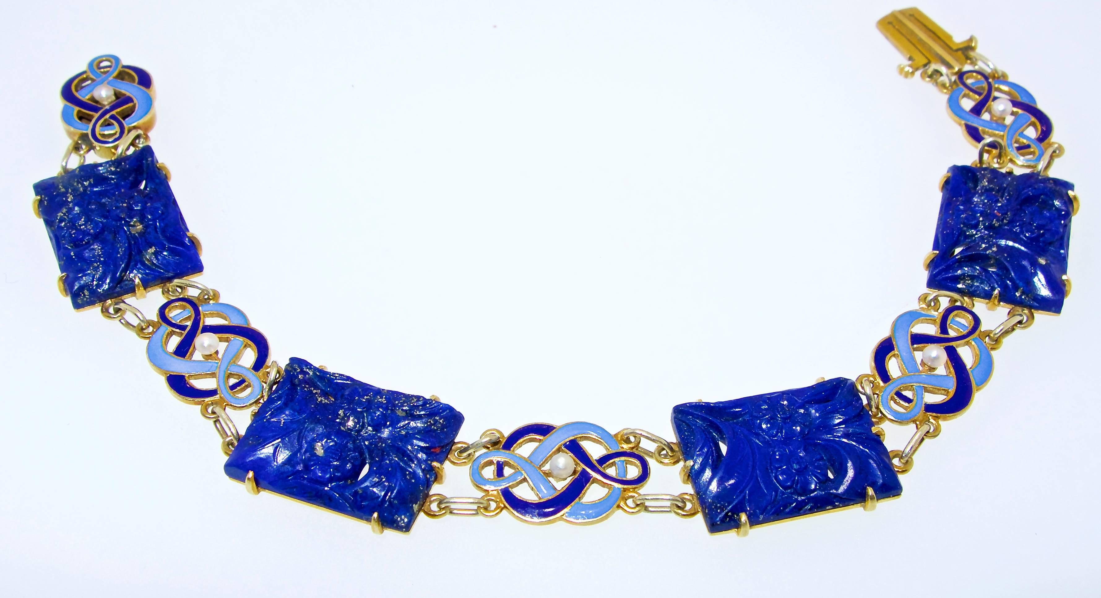 Cartier early Art Deco with carved lapis, two colors of blue enamel centering fine small natural pearls.  This link bracelet is signed and numbered on the verso of the clasp.  7.25 inches long.

Foremost in the acquisition and sale of important