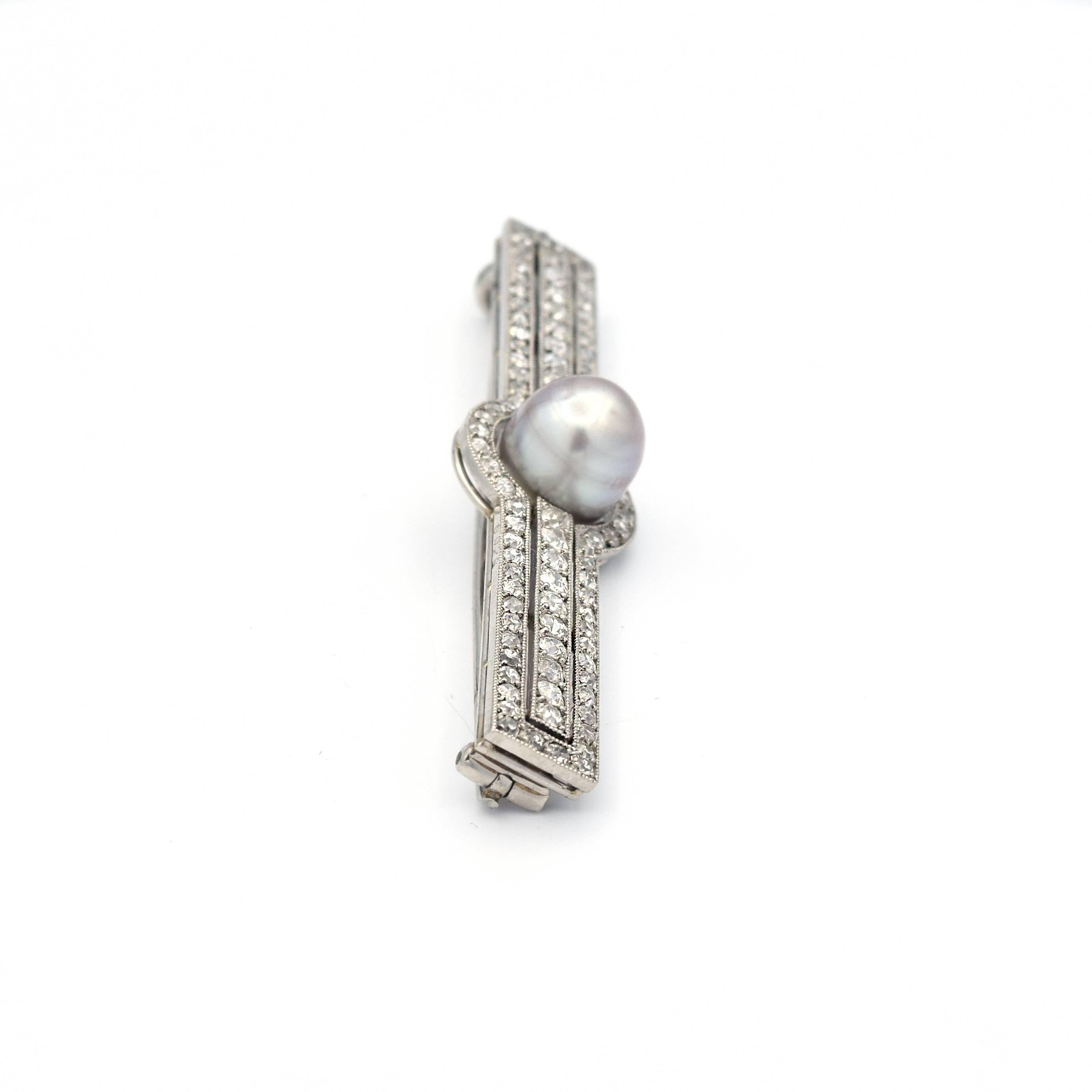 An Early 20th Century colored natural saltwater baroque pearl mounted with beautiful diamonds, by Cartier. 

Set to the front with a button-shaped grey natural pearl, measuring approximately 8.60-8.70x9.20 mm, to the old-cut diamond bar brooch,