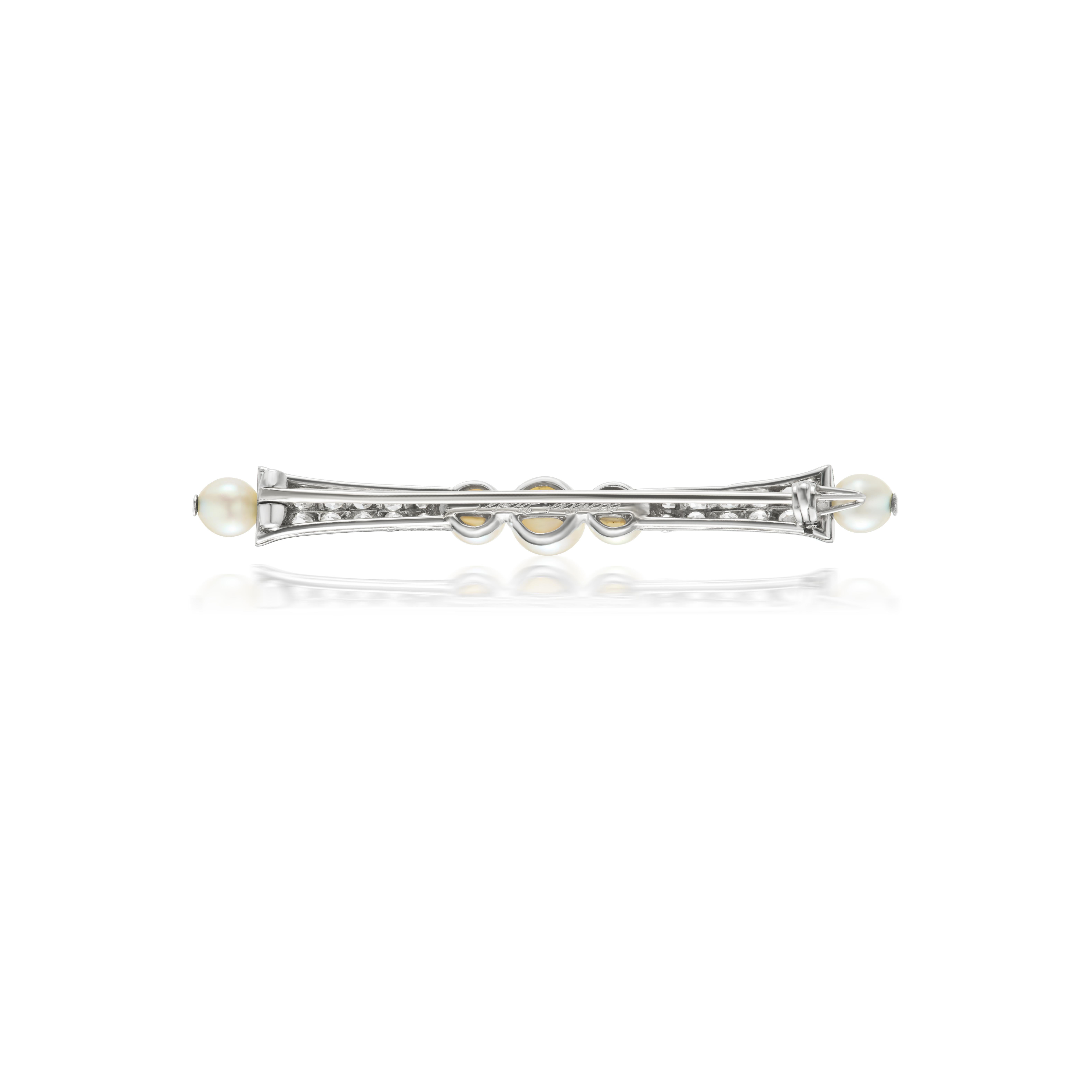 Sweet and delicate early Art Deco Cartier pin featuring 5 natural pearls and 26 old mine single cut diamonds. Measuring 2 inches long in fine condition. 

Signed 