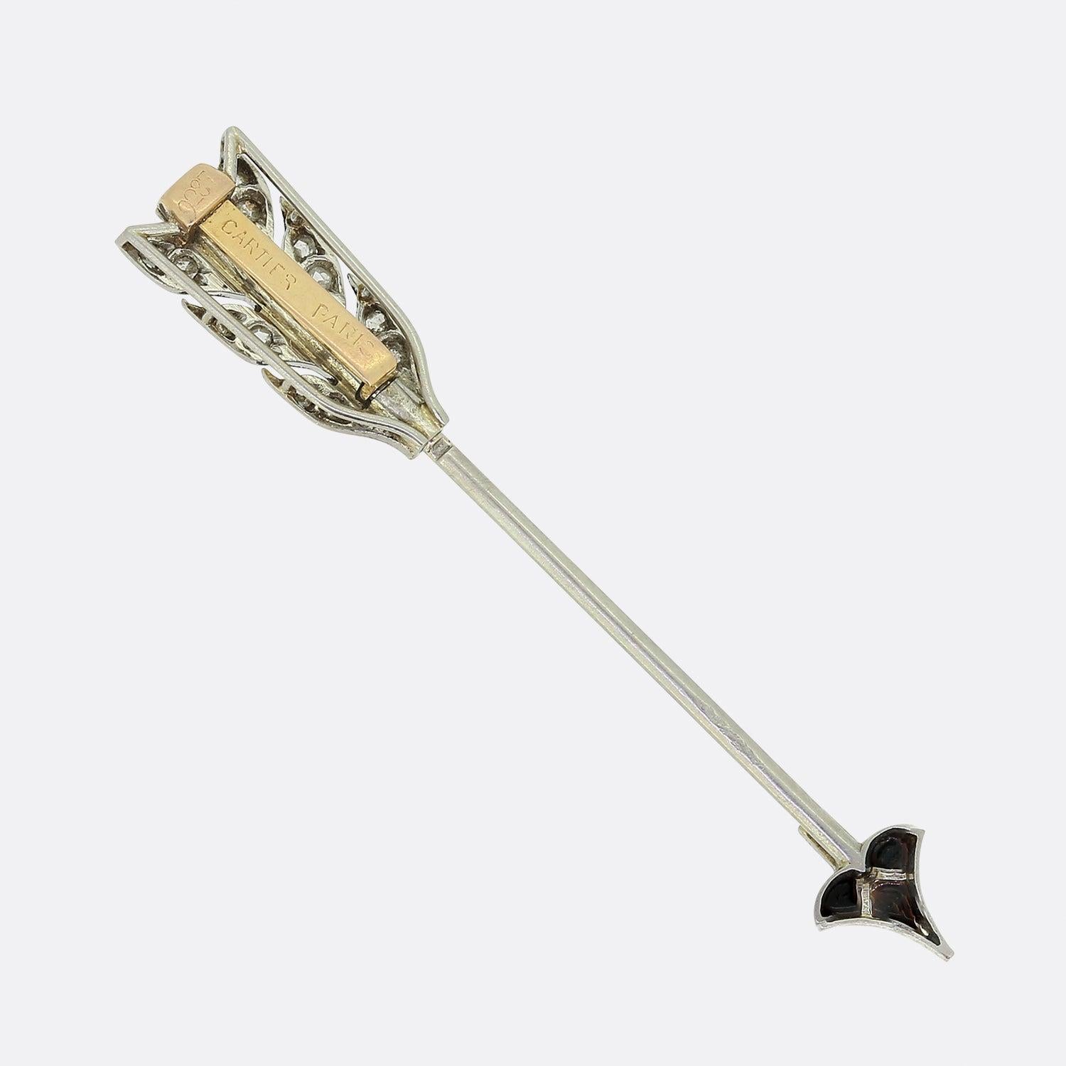 Here we have a fabulously rare Art Deco onyx and diamond arrow jabot pin from the world renowned jewellery house of Cartier. This piece has been crafted in France from platinum and showcases calibre-cut onyx set at the tip and shaft whilst the