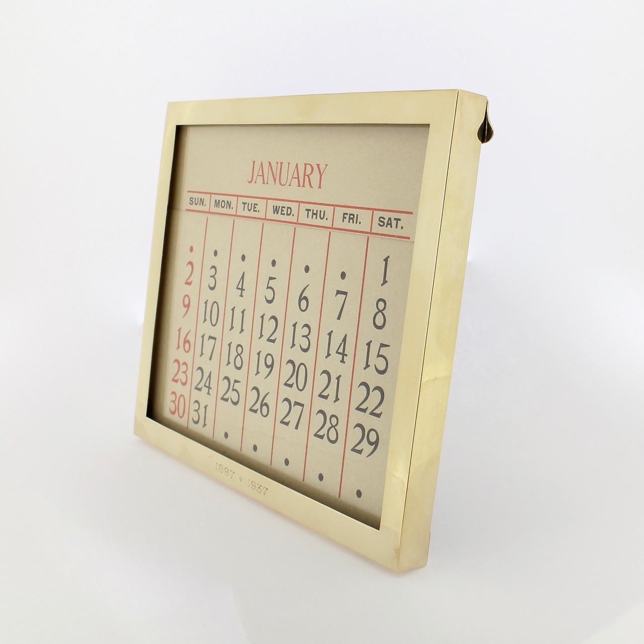 A very fine and rare Cartier 14k gold desk calendar.

Dating from the Art Deco period.

The frame is complete 6 double-sided month cards and 7 date cards that create a 'programmable', fully-functional full-year calendar. It is supported by its
