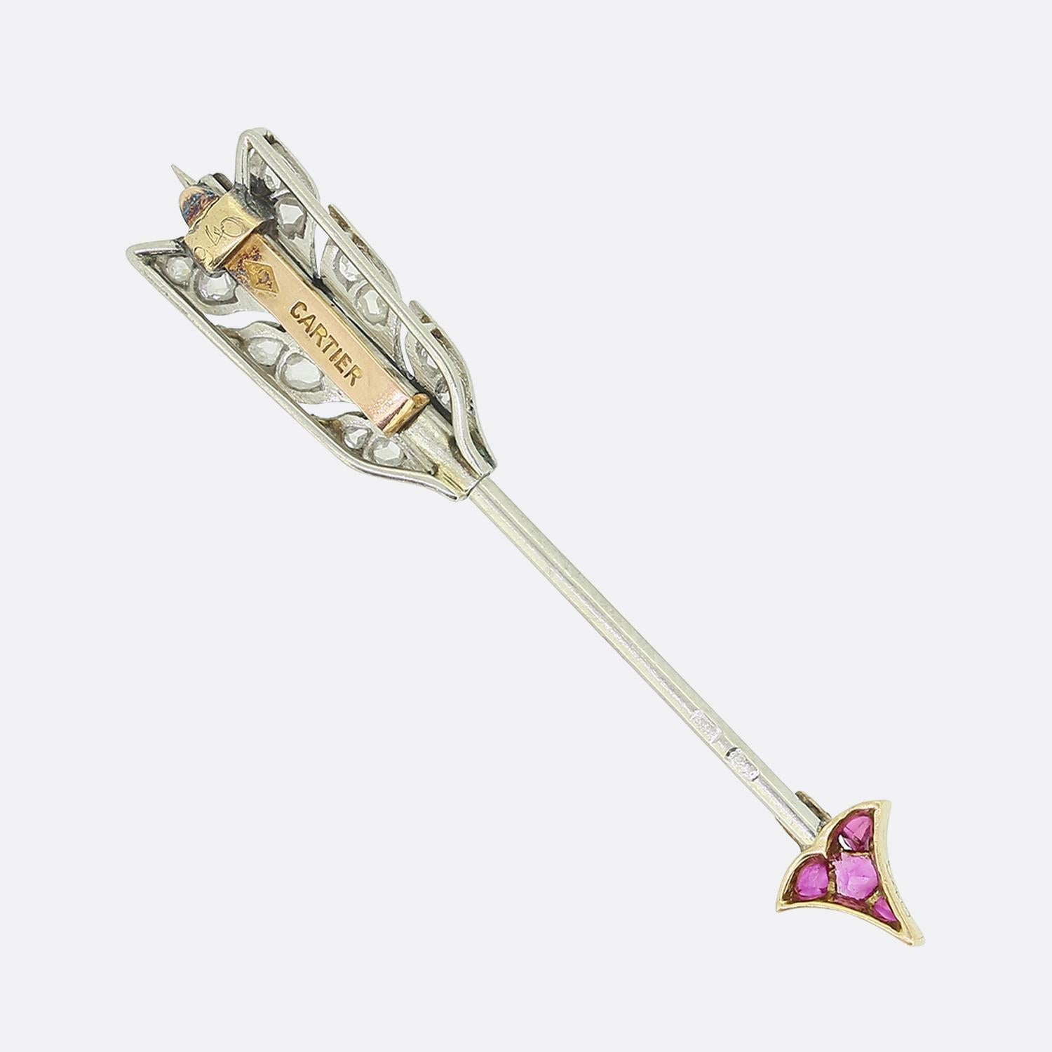 Here we have a fabulously rare Art Deco ruby and diamond arrow jabot pin from the world renowned jewellery house of Cartier. This piece has been crafted in France from platinum and showcases calibre-cut pinky rubies set at the tip and shaft whilst