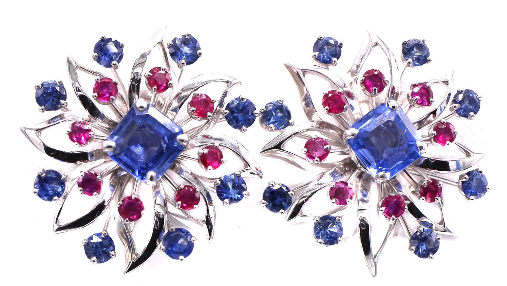 Beautifully designed and masterfully handcrafted in platinum these Art Deco ear clips from ca 1930 by Cartier are truly a piece of art on the ear. Centrally set with a square step cut sky blue sapphire and embellished by an inner circle of deep red