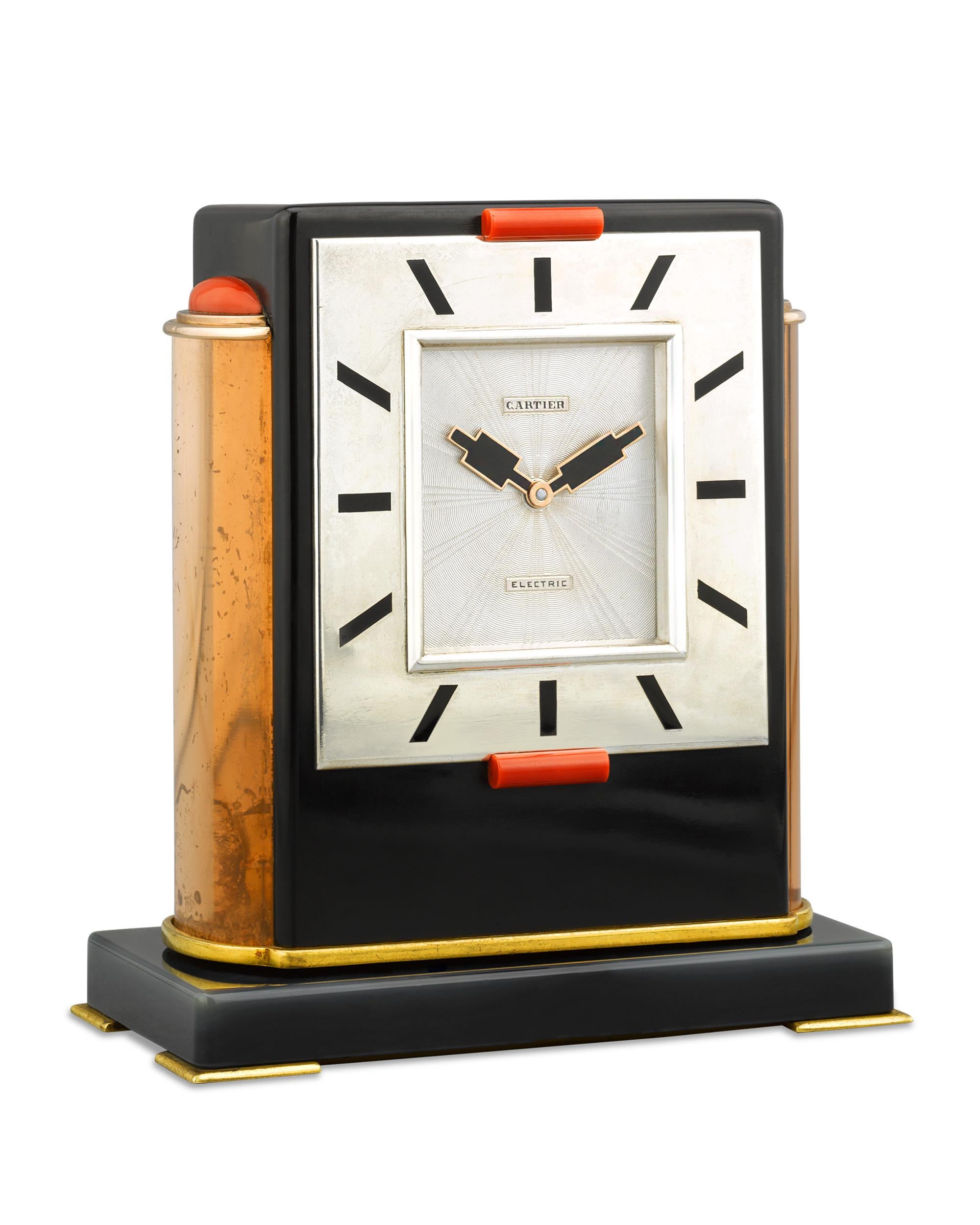This Art Deco period table clock by Cartier is an extremely rare find and in a class of its own. Crafted of black lacquer, no detail was spared by the famed firm in creating this high-quality, luxury timepiece. The silver square dial, signed