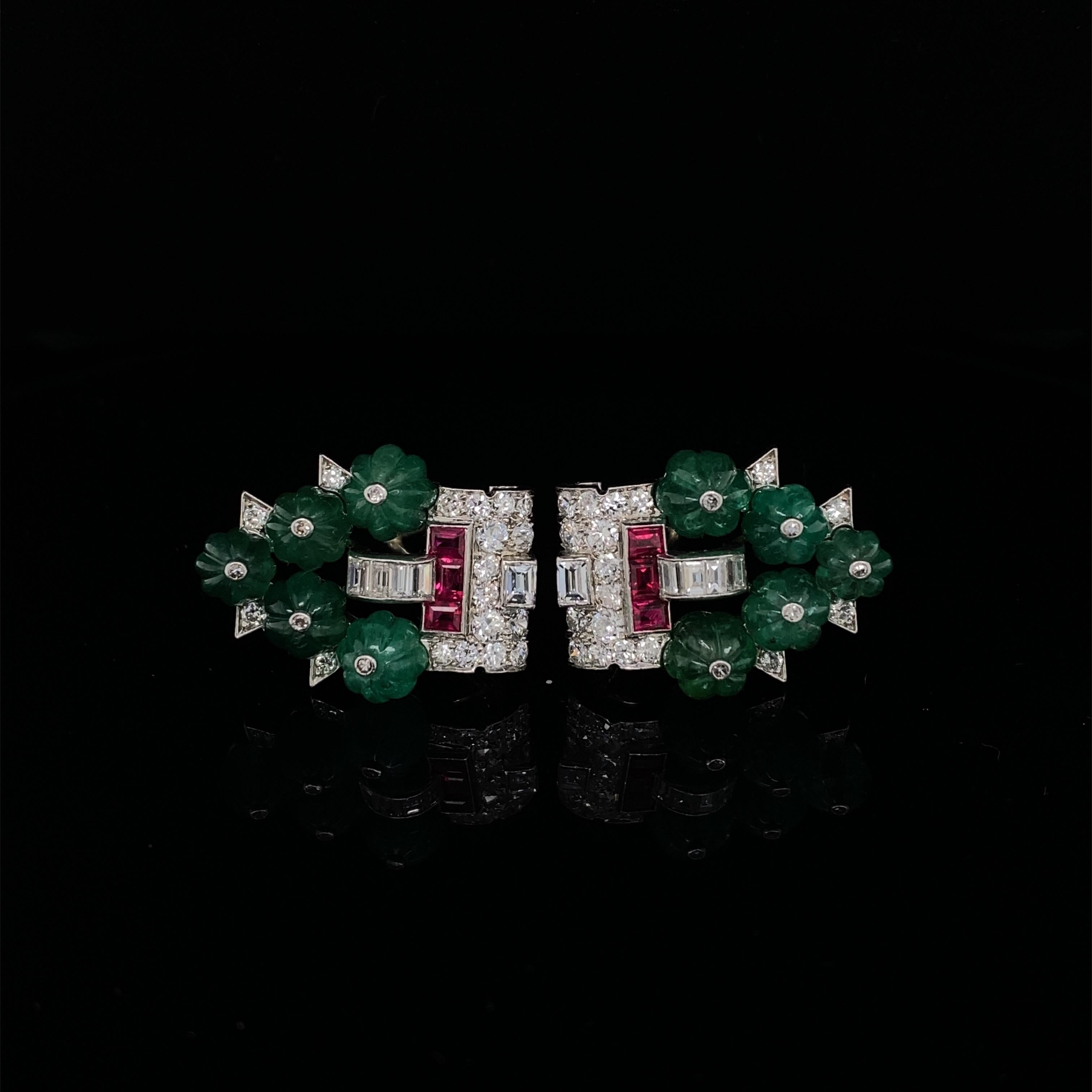 A Cartier New York Art Deco Tutti Frutti double clip brooch.

An exceptional piece, a beautiful example of Cartier's iconic Tutti Frutti design adorned with carved emeralds, baguette and round brilliant cut diamonds with calibré-cut ruby