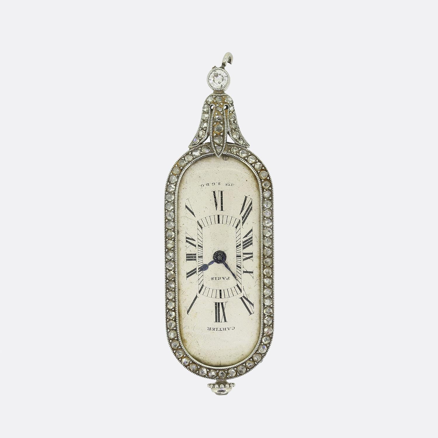 Here we have an exquisite watch fob pendant from the world renowned luxury jewellery house of Cartier. This sophisticated Art Deco piece showcases an elongated oval case which has been crafted from 18ct white gold and adorned with a border of rose