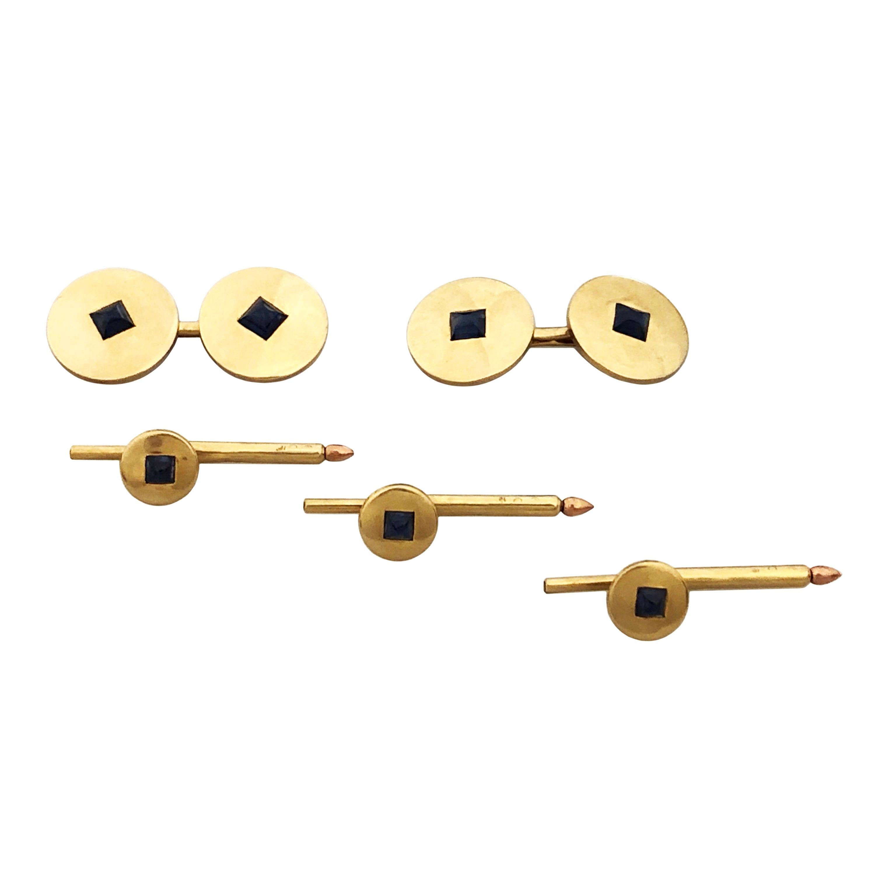 Circa 1940 Cartier Tuxedo dress set, the 14k yellow Gold disk form Cufflinks measure 5/8 inch in Diameter and are centrally set with a Sugar loaf Cabochon Sapphire, the 3 shirt studs each measure 5/16 inch in diameter and are also set with a Sugar