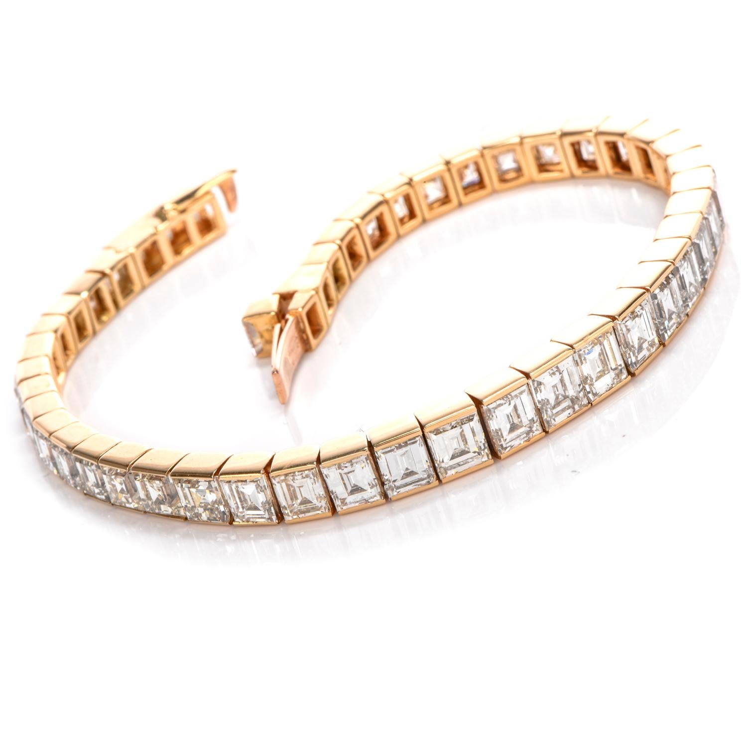 This elegant 1980's Cartier line bracelet has channelled High qiality Asscher Cut Dimaonds throughout with a slight taper from center to ends and contains a hidden lockingcatch with safety. The diamonds weigh approximately approximately 24.00 carats
