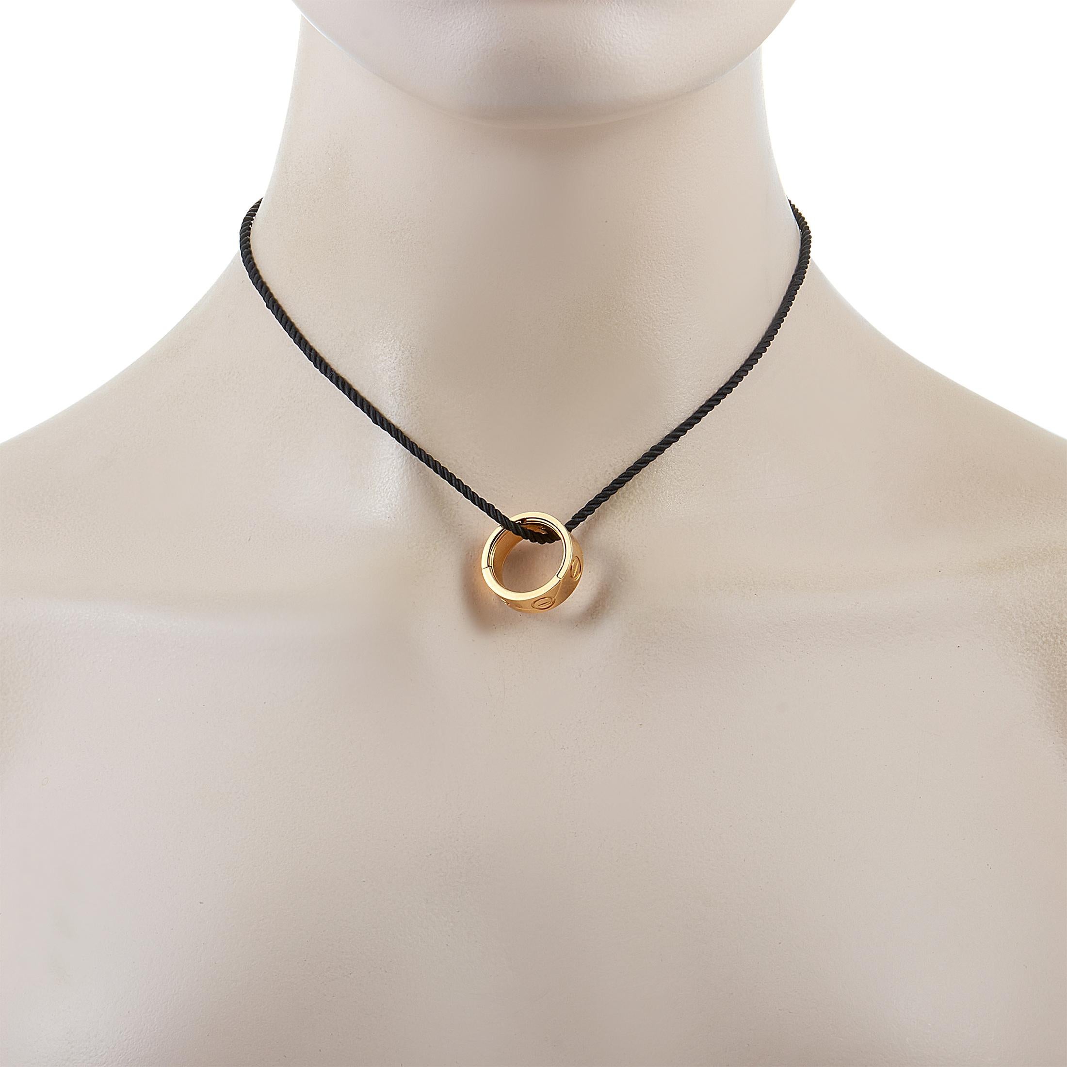 This Cartier necklace is presented with a black cord onto which an 18K yellow gold pendant is attached. The cord measures 15” in length and the pendant measures 0.75” by 0.75”. The necklace weighs 13 grams.

Offered in estate condition, this jewelry