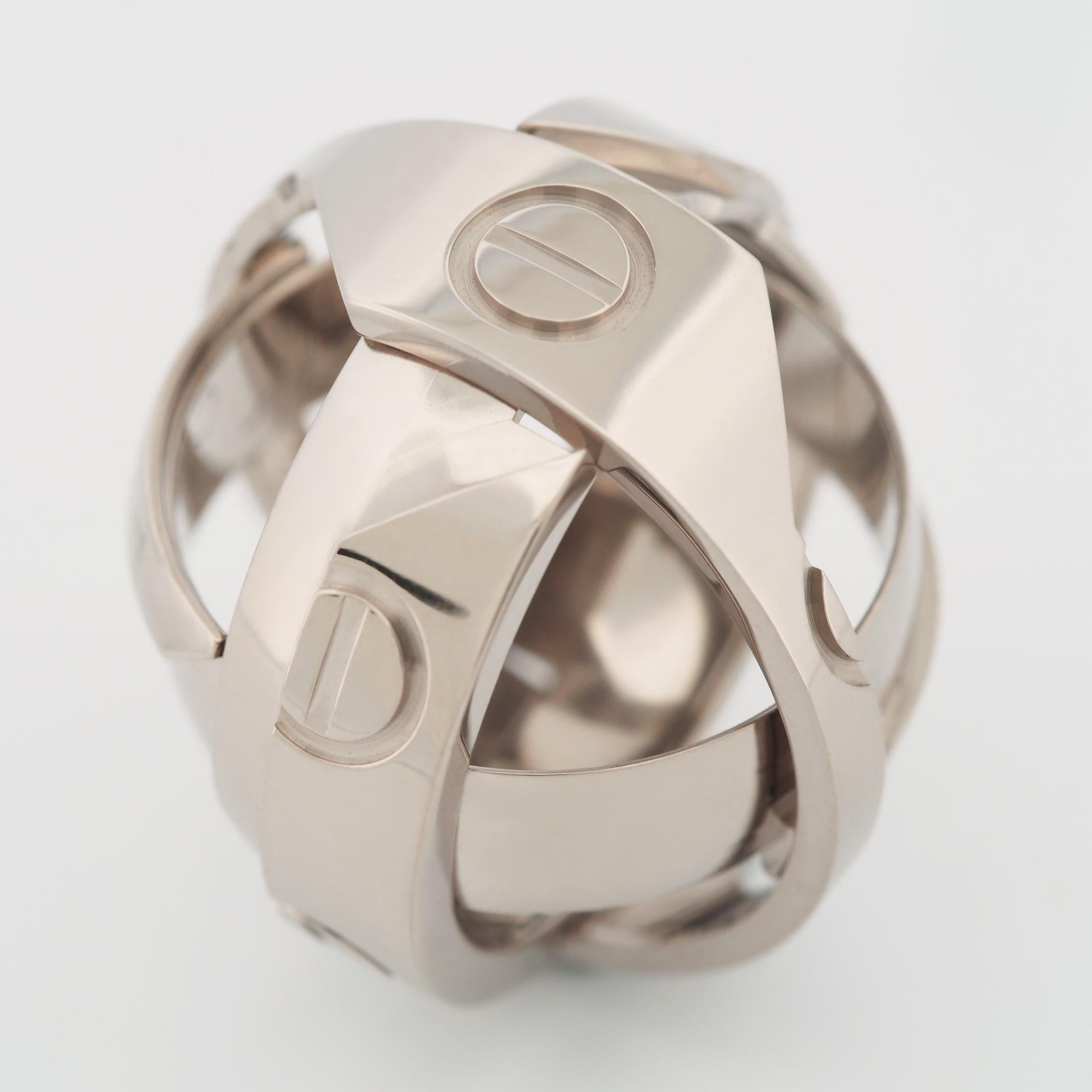 Item: Authentic Cartier Astro Love Ring ( 1999 Limited Edition )
Stones: ---
Metal: 18K White Gold
Ring Size: 56 US SIZE 7.5 UK SIZE O 1/2
Internal Diameter:  17.75 mm
Measurement:  7.0 mm width
Weight:  13.7 Grams
Condition: Used