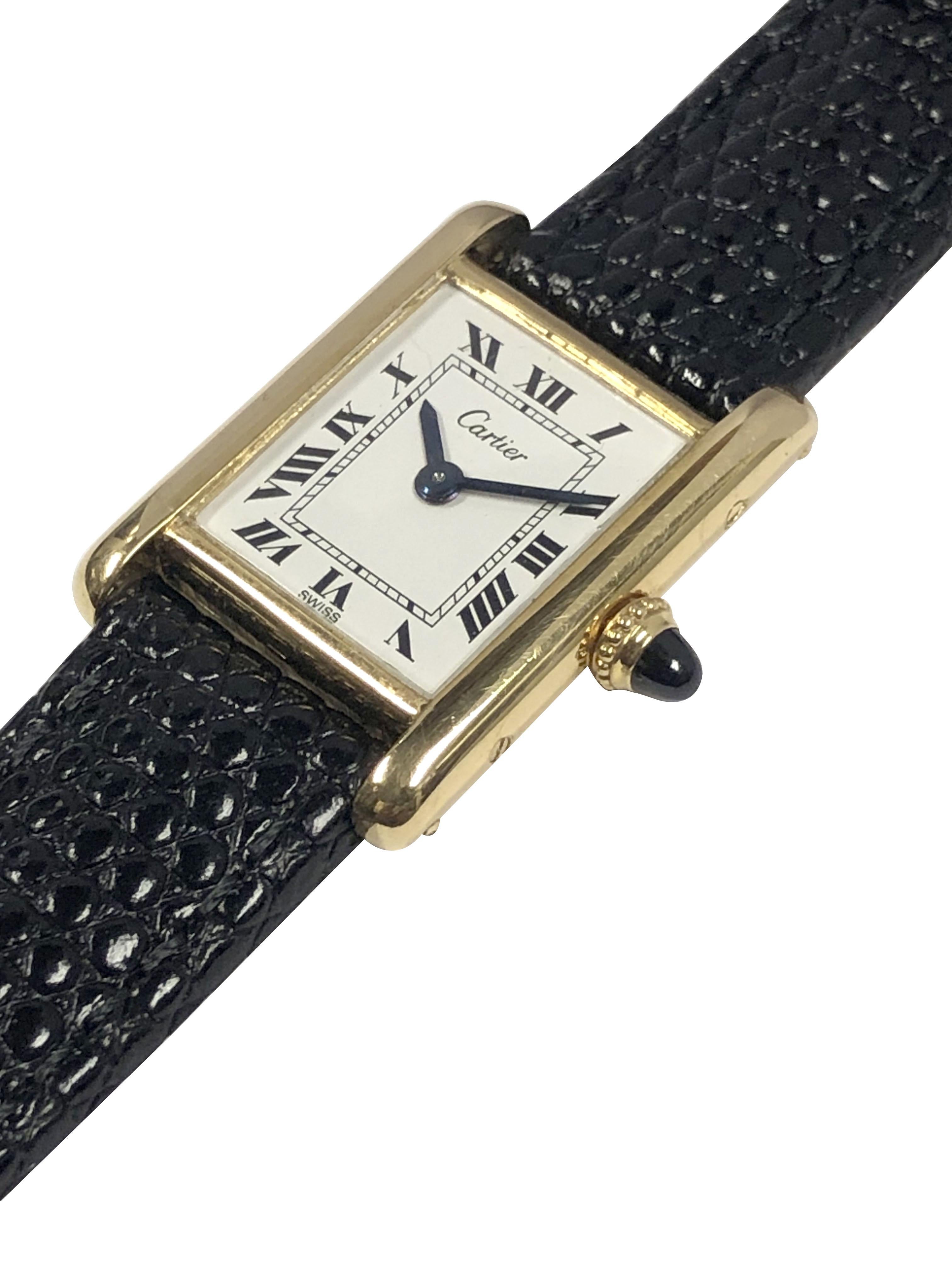 Circa 1970 Cartier classic Tank Wrist Watch, 20 x 20 M.M. 18k Yellow Gold 2 Piece case, Sapphire crown. 20 Jewel, Audemars Piguet Manual wind, Nickle Lever movement. White Enamel Dial with Black Roman Numerals. New Black Lizard Grain strap. Wrist