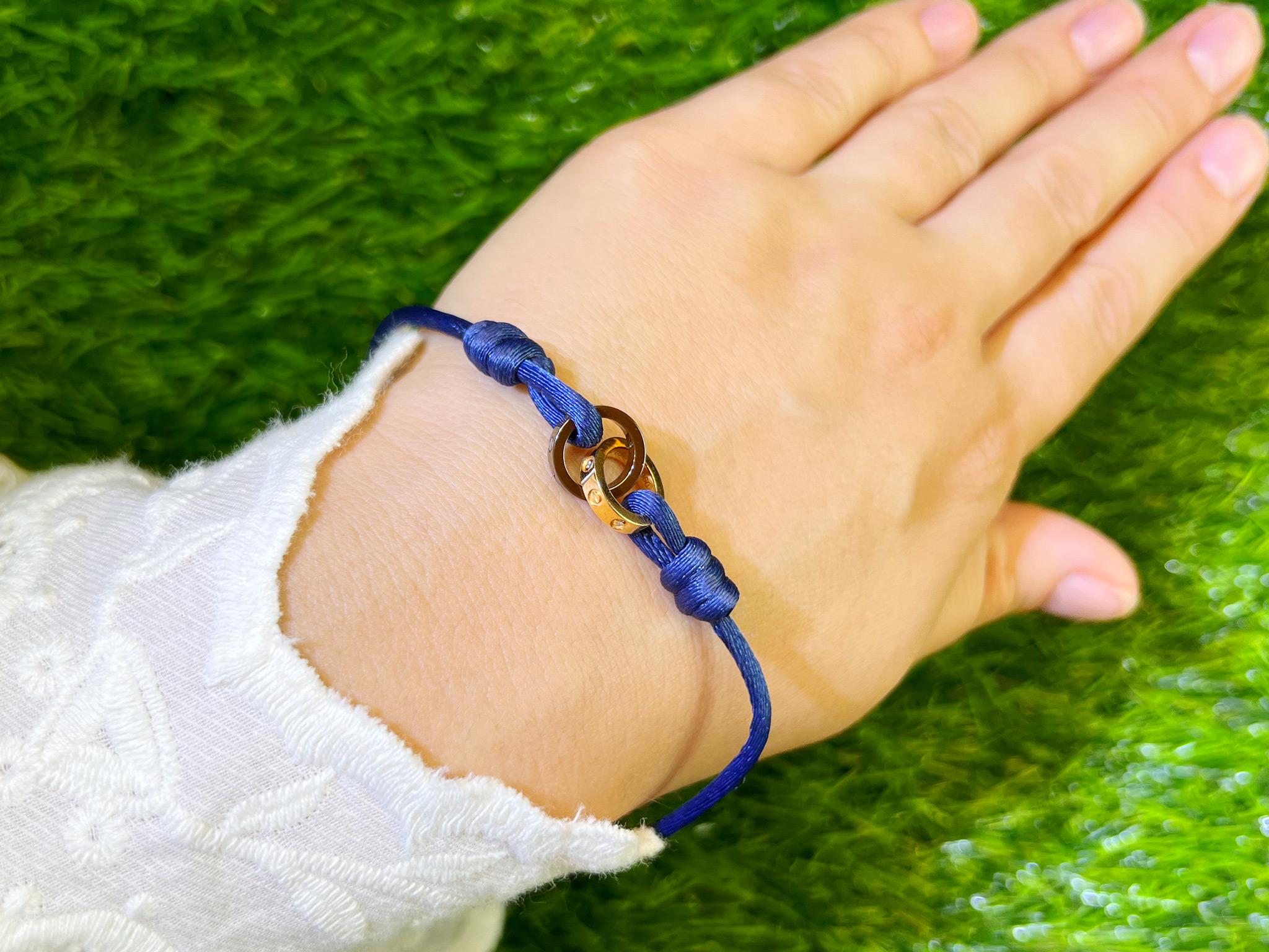 Brand: Cartier
Gemstones: Diamonds
Bracelet Color: Blue
Bracelet Length: Adjustable Length Up To 8 Inches
Metal: 18K Gold & Black Rhodium Plating
It comes with the Original Box