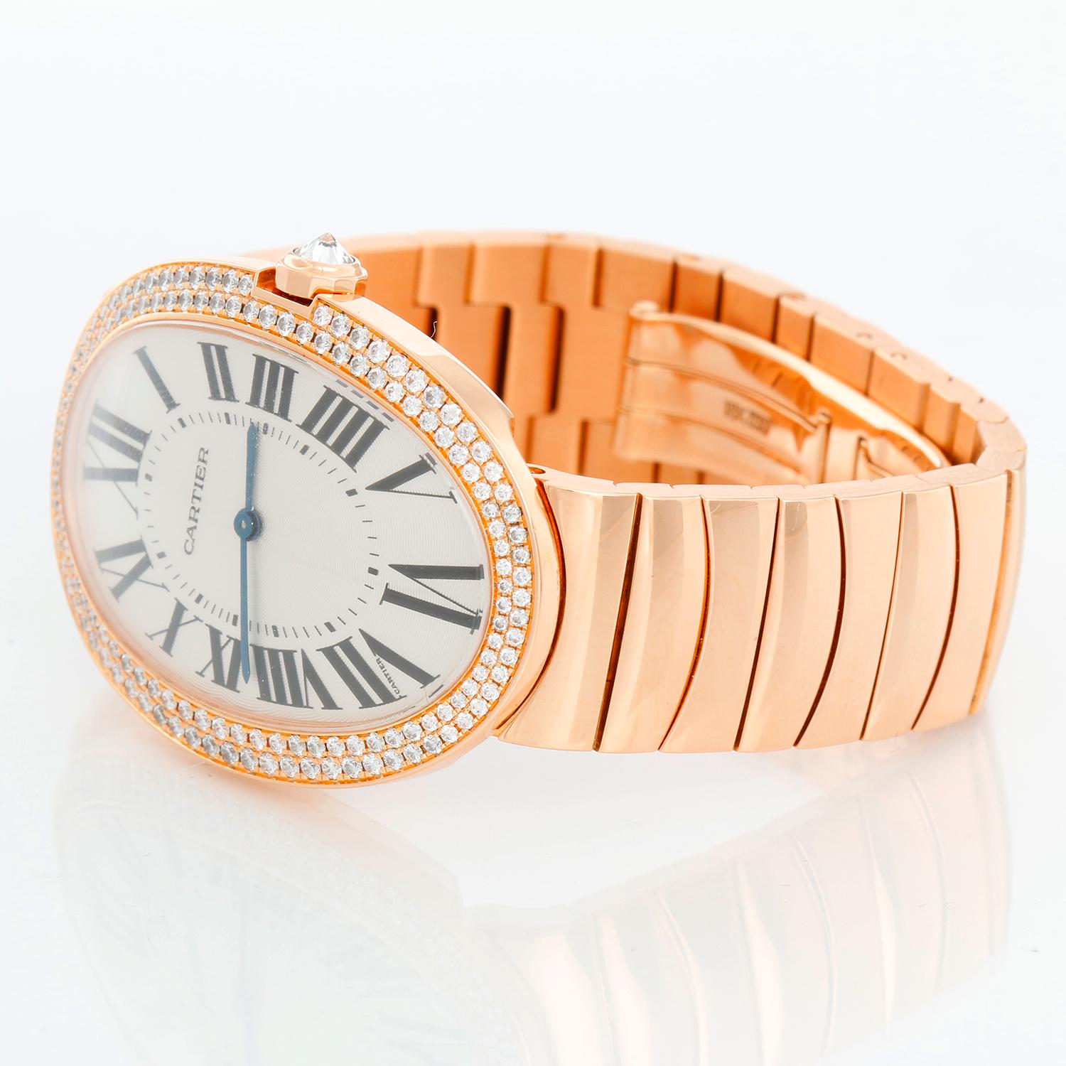 Cartier Baignoire 18K Rose Gold Watch WB520003 - Manual winding. 18K Rose gold with two rows of diamonds (44 mm ) 149 brilliant-cut diamonds and 12-sided crown set with a brilliant-cut diamond, totaling 1.44 carats. Guilloche dial with Roman