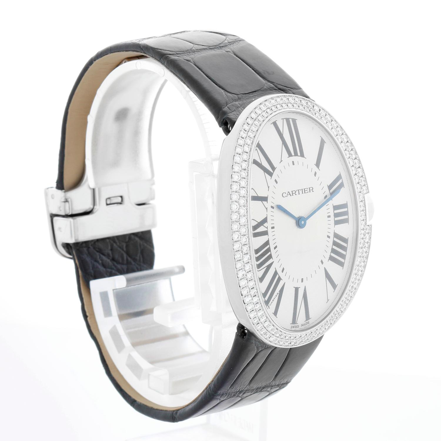 Cartier Baignoire 18K White Gold Watch 3032 WB520009 - Manual winding. Baignoire. 18K white gold with factory diamond bezel (32 x 44mm). Silver guilloche dial with black Roman numerals. New Black Cartier leather strap with White Gold deployant