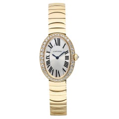 Cartier Montre Baignoire à quartz en or jaune 18 carats avec cadran en argent et diamants WB520019