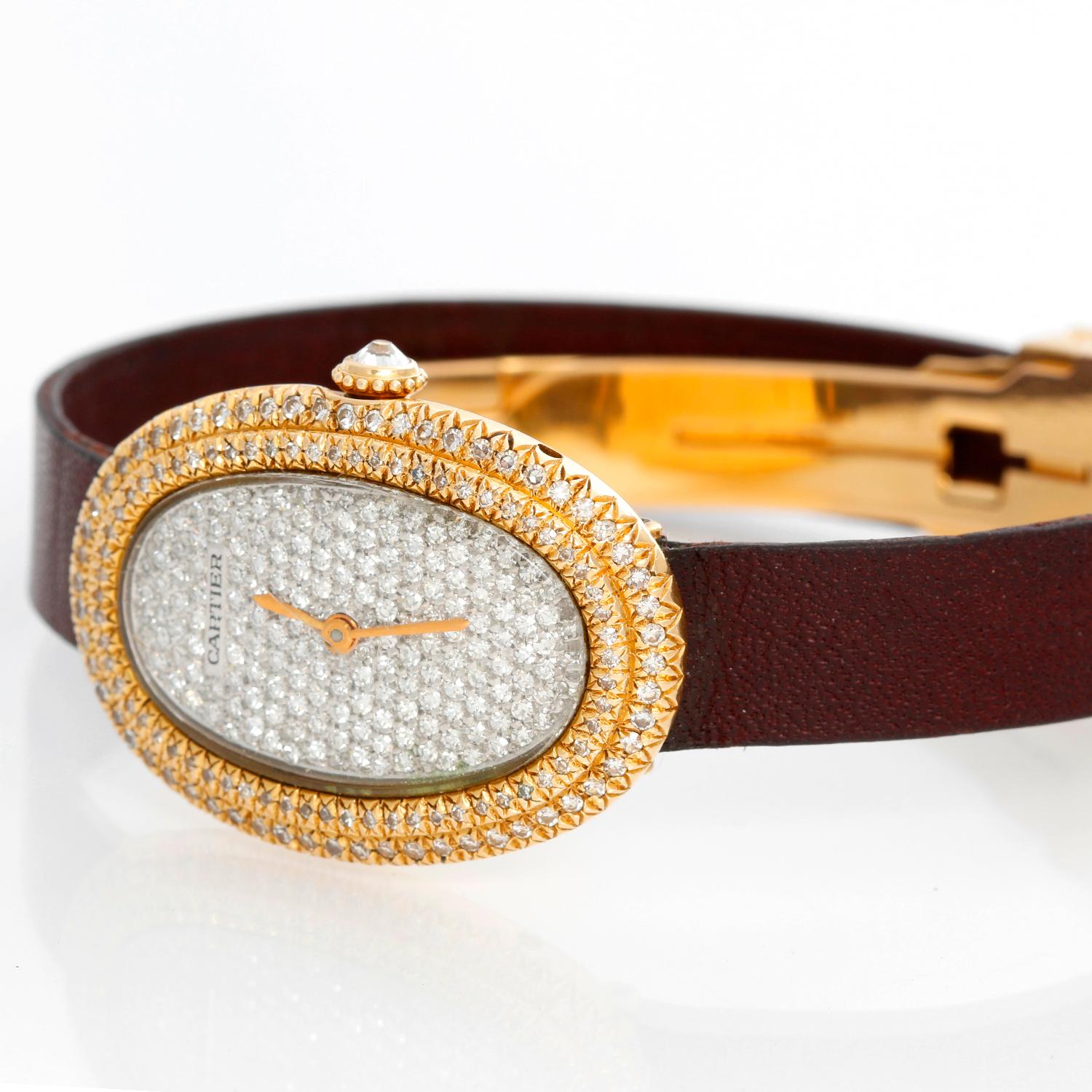 Cartier Baignoire 18K Yellow Gold  Pave Diamond Watch - Manual. 18K Yellow gold case with pave diamonds ( 22 x 31 mm ) . Pave diamond dial. Burgundy leather strap with 18K Yellow gold deployant clasp. Pre-owned with Cartier box. 