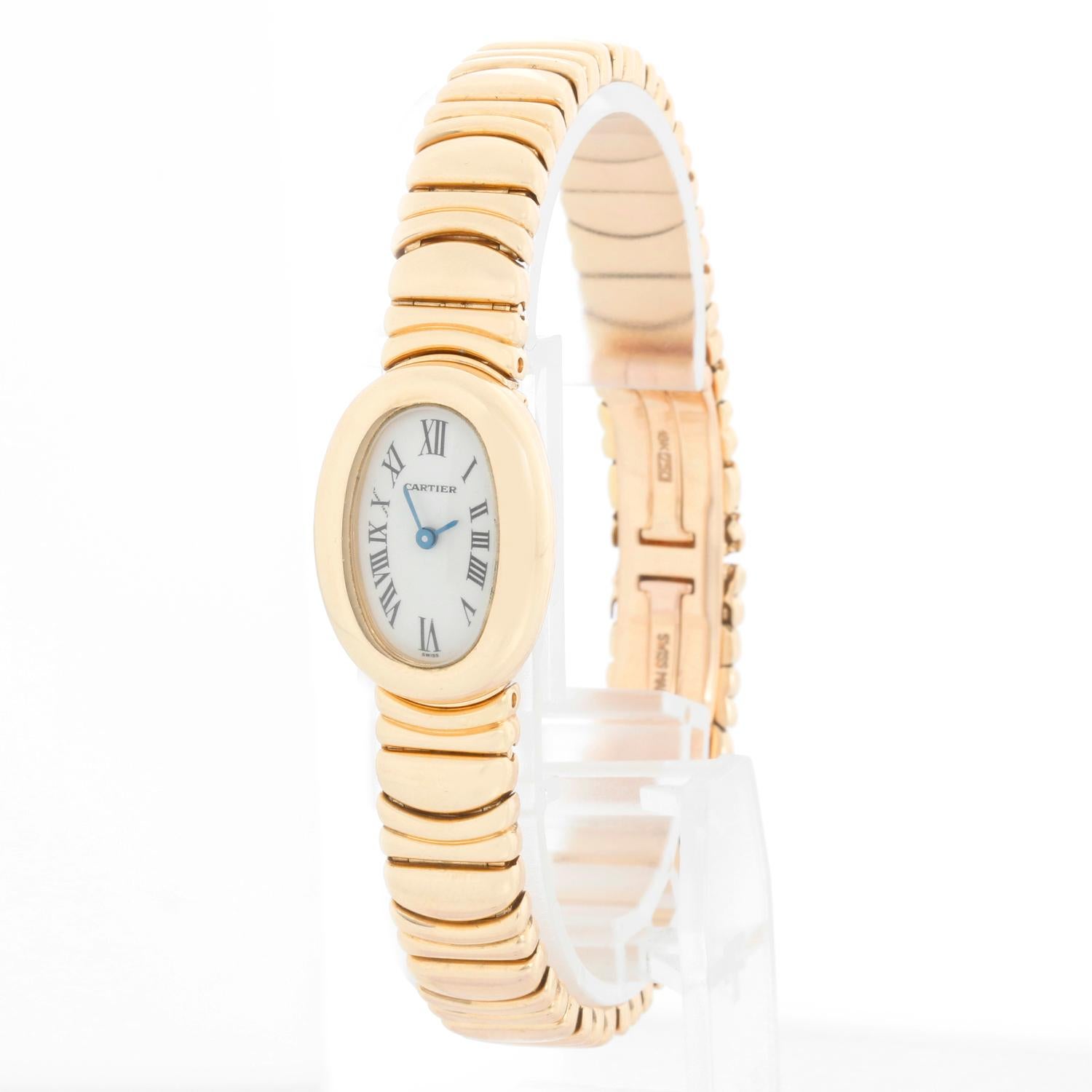 Cartier Baignoire 18K Yellow Gold Watch W15045D8 - Quartz. 18K Yellow gold (20 x 23mm). White dial with black Roman numerals. 18K yellow gold bracelet; will fit up to a 7 1/4  inch wrist . Pre-owned with Cartier box and papers. Open papers .
