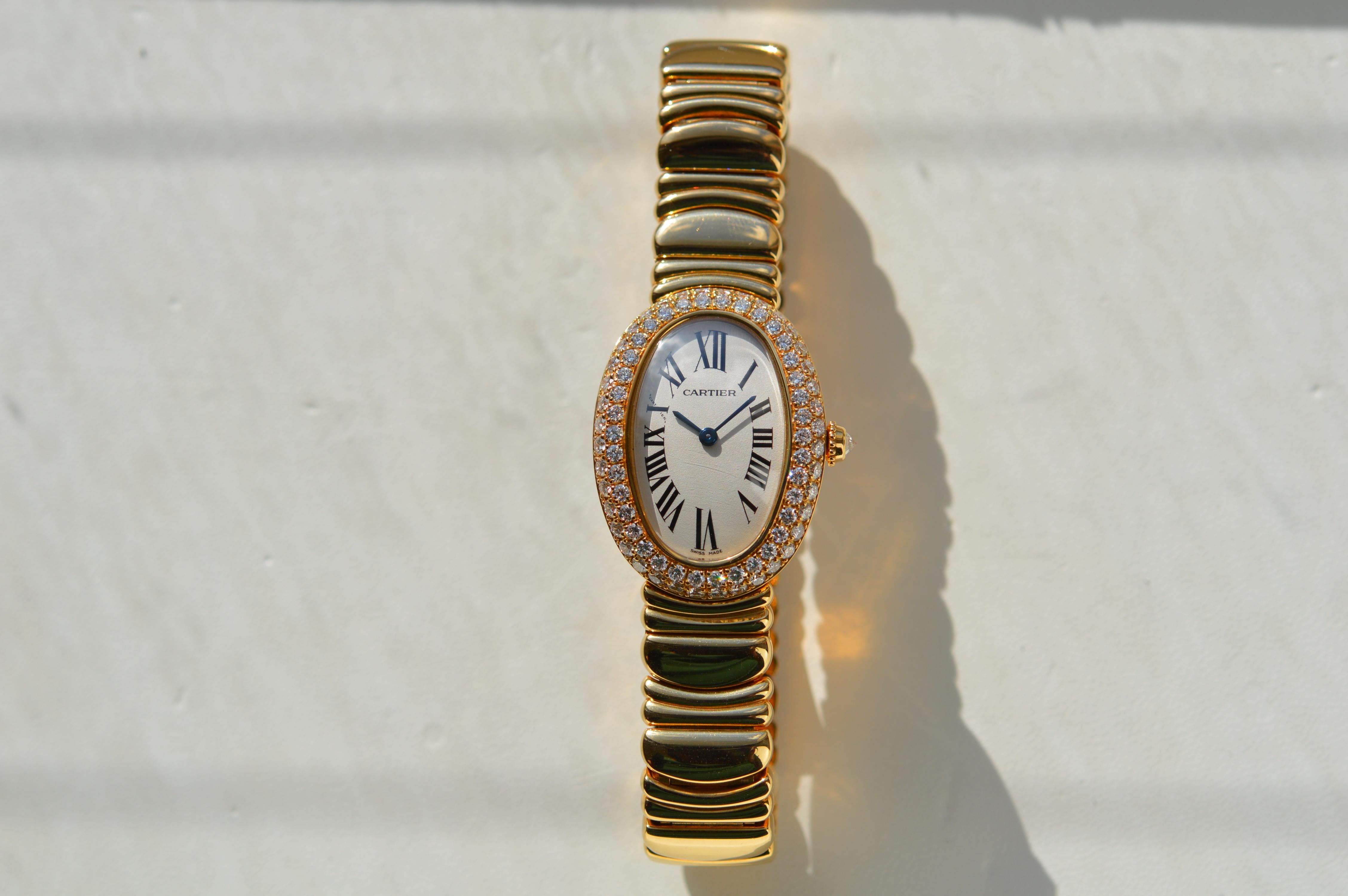 Cartier Baignoire 1920 Full 18K Yellow Gold
Reference n° W5096D8
31mm X 23mm
18K Yellow Gold Case and Bracelet
Diamond paved Case
Diamond Crown
79 Round Diamonds for a total of 1.77 cts
Cream/White Dial
Blued Steel Sword Shaped Hands
Water Resistant