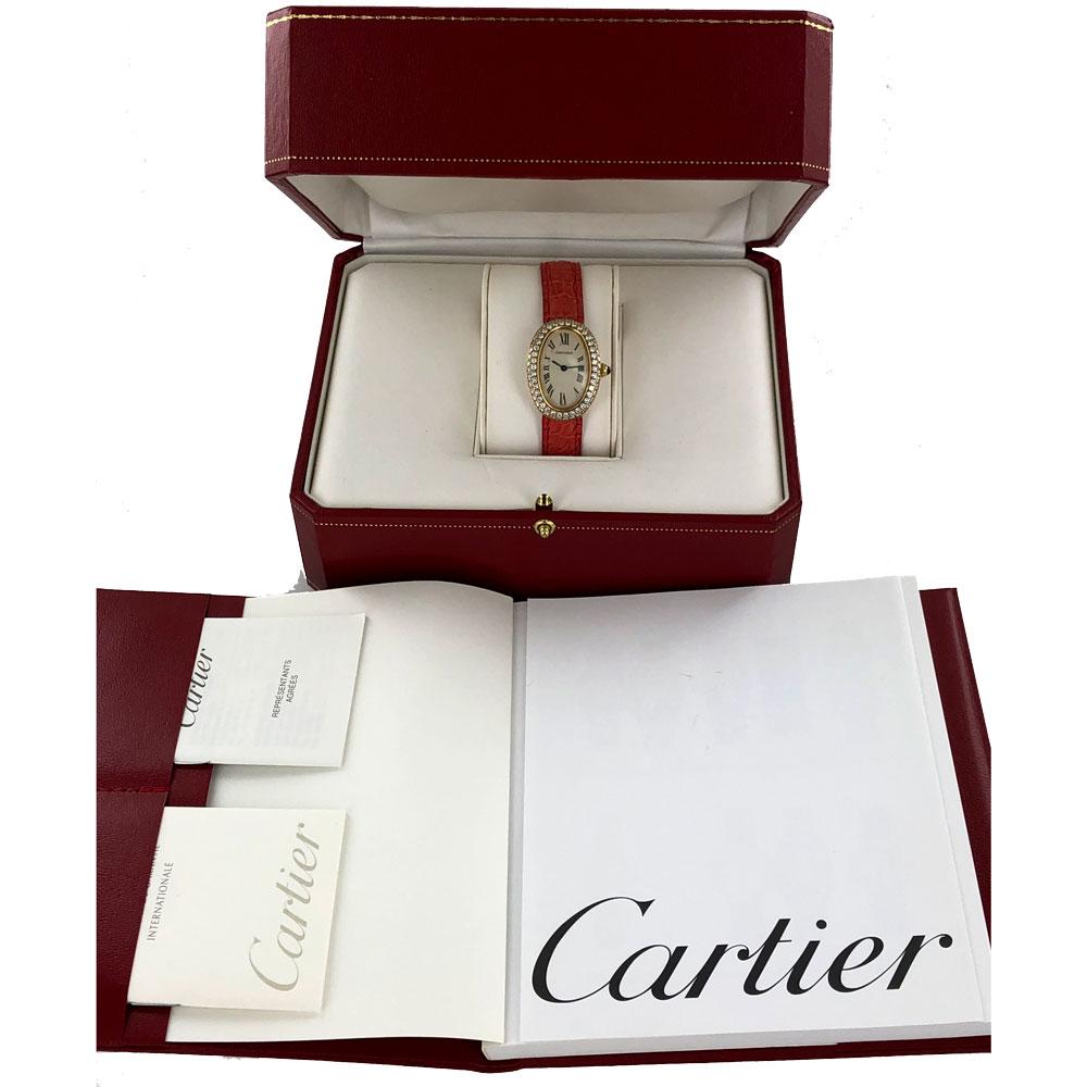 Beautiful Cartier Baignoire watch circa 2000. The watch has a new Cartier strap with original 18k gold deployment buckle. The oval 18k gold bezel features two rows of round brilliant cut diamonds. Case measures approximately 24.5 x 32mm. 
Original