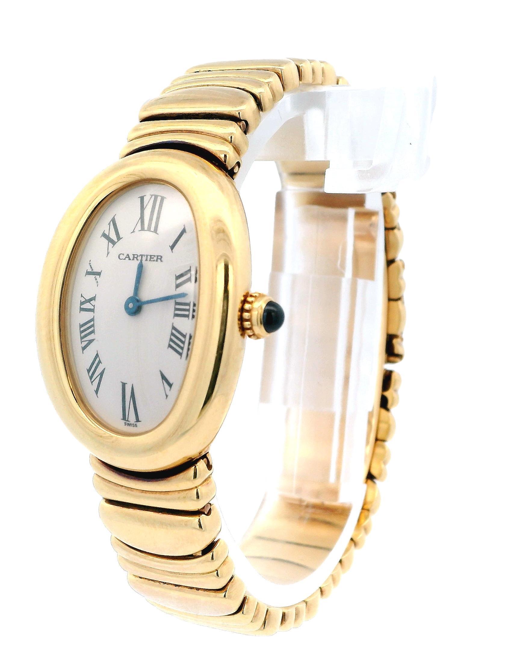 Pre-owned Cartier Baignoire 1954 Ladies Watch. 22mm by 30mm 18k Yellow Gold case non bezel. Ivory dial with blue hands and roman numeral hour markers. 18K Yellow Gold bracelet with hidden Butterfly Clasp fit to a 6-inch wrist size comfortable.