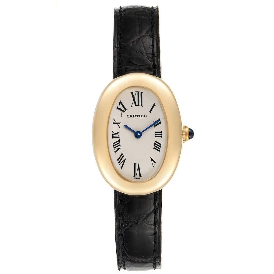Cartier Baignoire Silver Dial Black Strap Yellow Gold Ladies Watch 1954. Quartz movement. 18k yellow gold oval case 31.0 x 22.5 mm. Crown set with blue sapphire cabochon. 18k yellow gold bezel. Scratch resistant sapphire crystal. Silver dial.