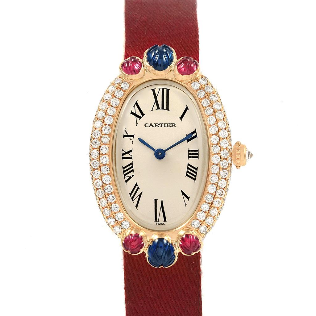 Cartier Baignoire Tutti Frutti Yellow Gold Ruby Sapphire Diamond Watch. Quartz movement. 18k yellow gold oval case 35.5 x 22.5 mm. Pave-set diamond bezel centred by ruby and sapphire Tutti Frutti decoration to both ends, back secured by four screws.