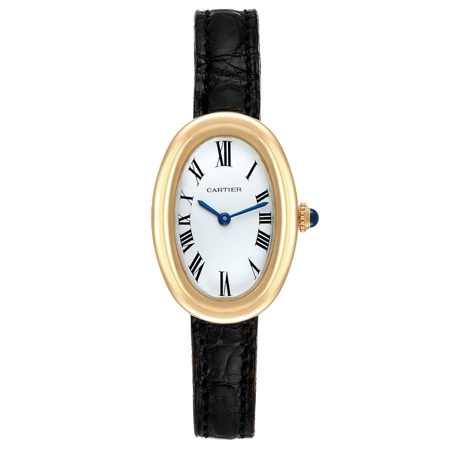 Cartier Baignoire White Dial Black Strap Yellow Gold Ladies Watch. Manual winding movement. 18k yellow gold oval case 31.0 x 22.0 mm. Crown set with blue sapphire cabochon. 18k yellow gold bezel. Acrylic  crystal. White dial. Painted black roman