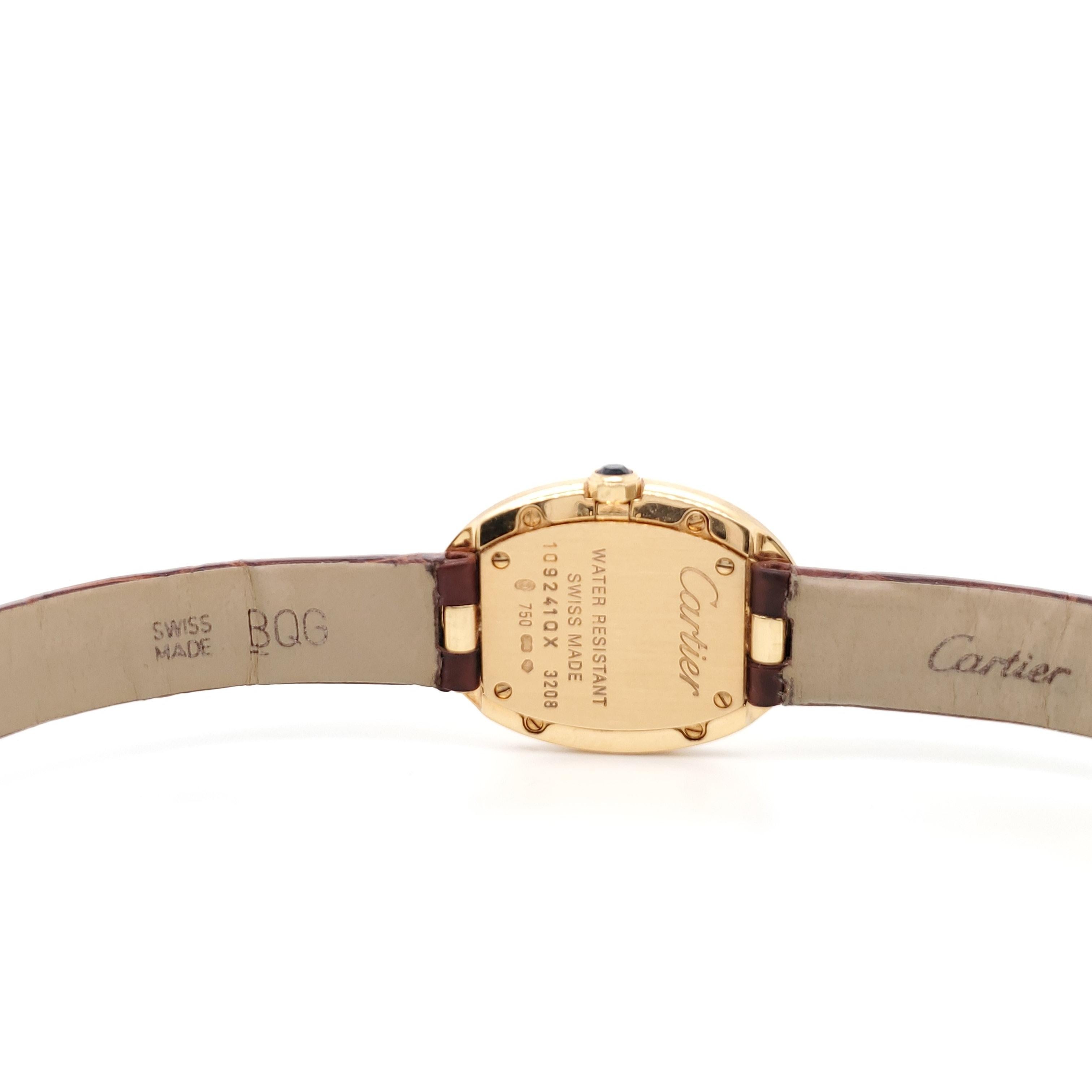 Authentic timeless Cartier Baignoire watch in 18 karat yellow on slender brown leather strap. 32mm x 24mm dial features black roman numerals and signature blue sword-shaped hands. Sapphire crystal. Quartz movement. Case, dial and movement signed