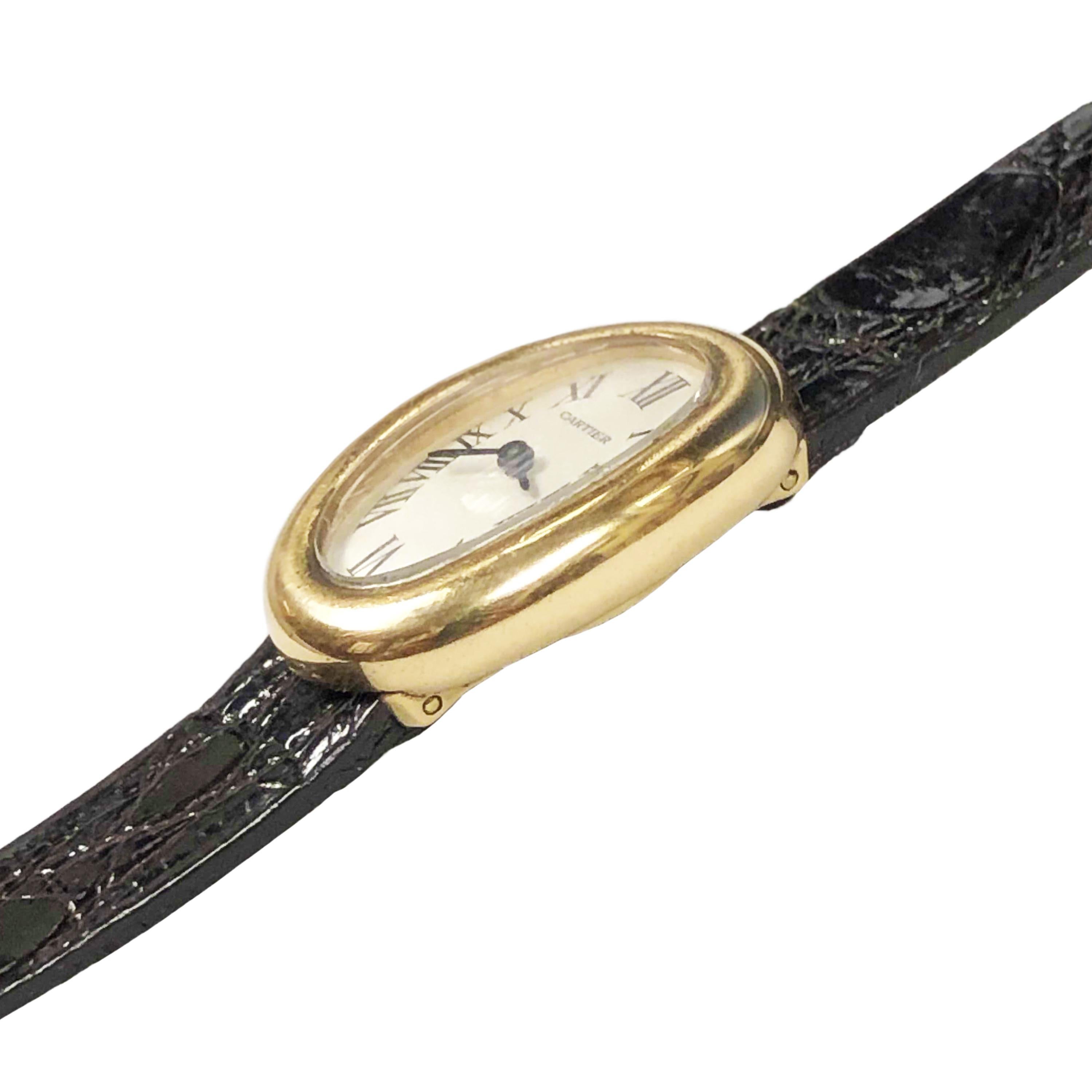 Circa 1980 Cartier Baignoire Wrist watch owned and worn by Hollywood Icon Jerry Lewis. 25 X 18 MM 18K yellow Gold 2 piece Case. Back set Quartz Movement. White dial with Black Roman Numerals. New brown Alligator Strap with Cartier 18k Tang buckle,