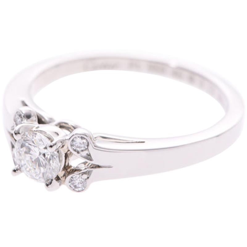 Cartier has an international reputation for its beautiful and well-crafted jewellery and is particularly known for their engagement rings. This stunning ring is made from platinum. It features a large diamond in the center with floral patterns on
