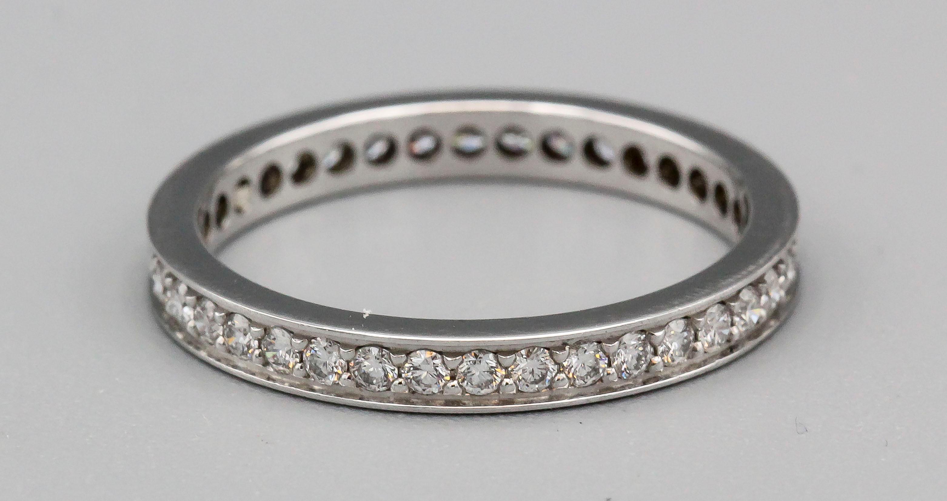 Fine diamond and platinum band by Cartier. It features high grade round brilliant cut diamonds of approx. .4 carats, measures 2.4 mm wide, and is currently retailing for $5500. Approx. size 5.25 (European size 50)

Hallmarks: Cartier, Pt950, 50,