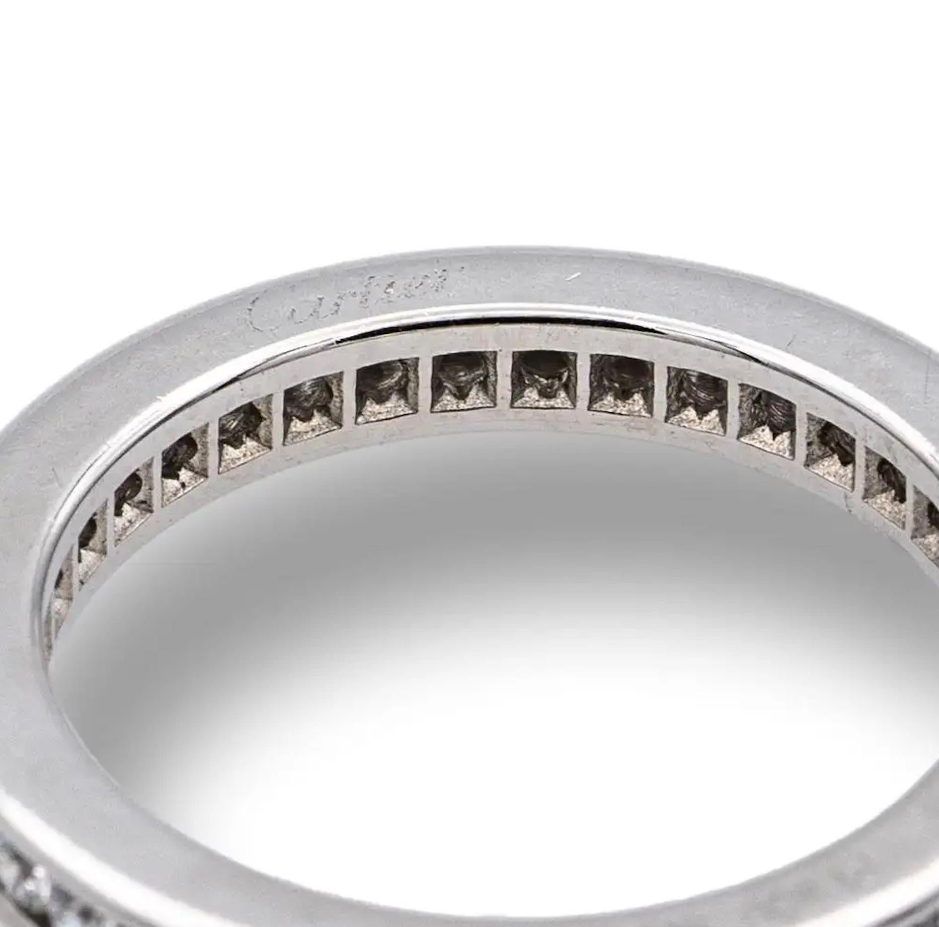 Cartier diamond band ring from the Ballerine collection finely crafted in platinum with channel set round brilliant cut diamonds weighing 0.40 cts total weight approximately set all the way around. Hallmarks are faded. Ring has only been lightly
